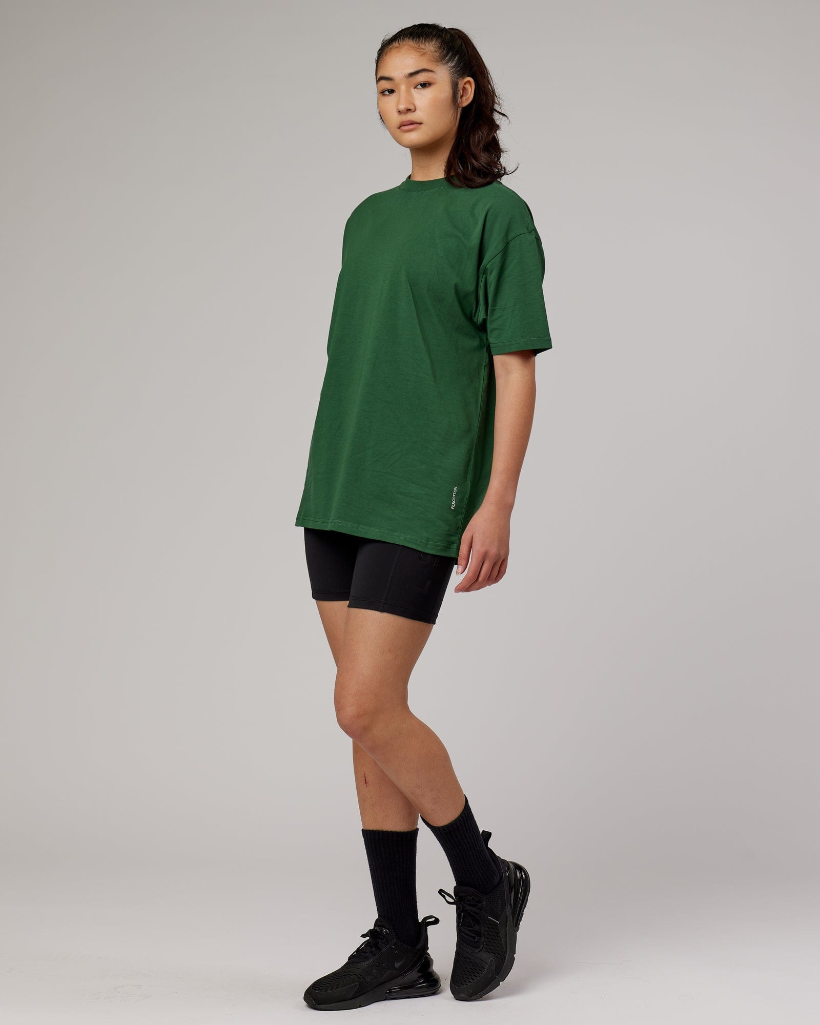 Model wearing Unisex DownLow FLXCotton Oversize Tee - Pineneedle