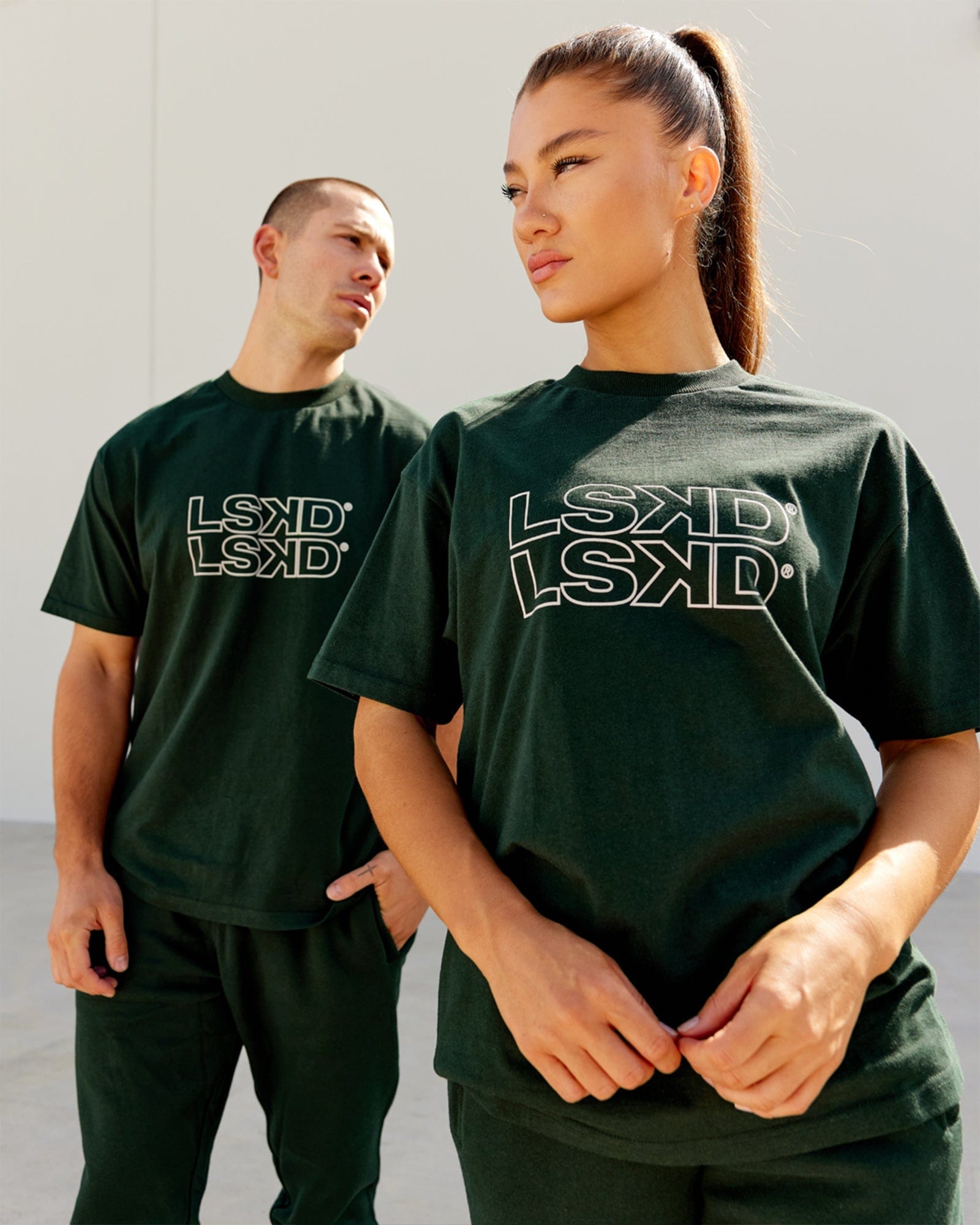 Model wearing Unisex Stacks Up Heavyweight Oversize Tee - Forest