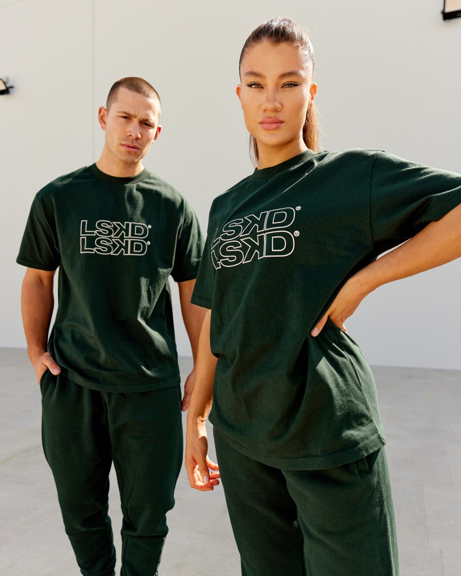 Model wearing Unisex Stacks Up Heavyweight Oversize Tee - Forest