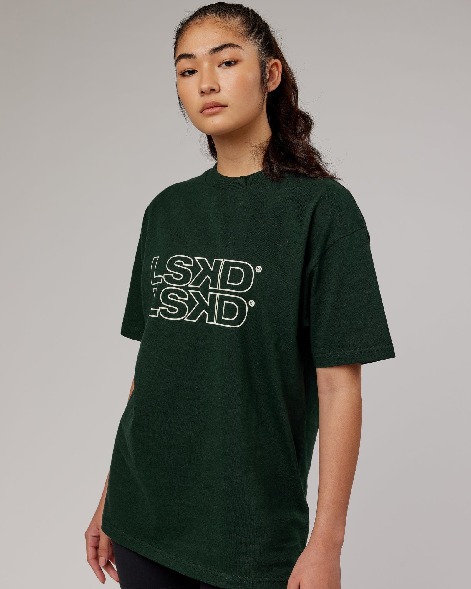 Model wearing Unisex Stacks Up Heavyweight Oversize Tee - Forest