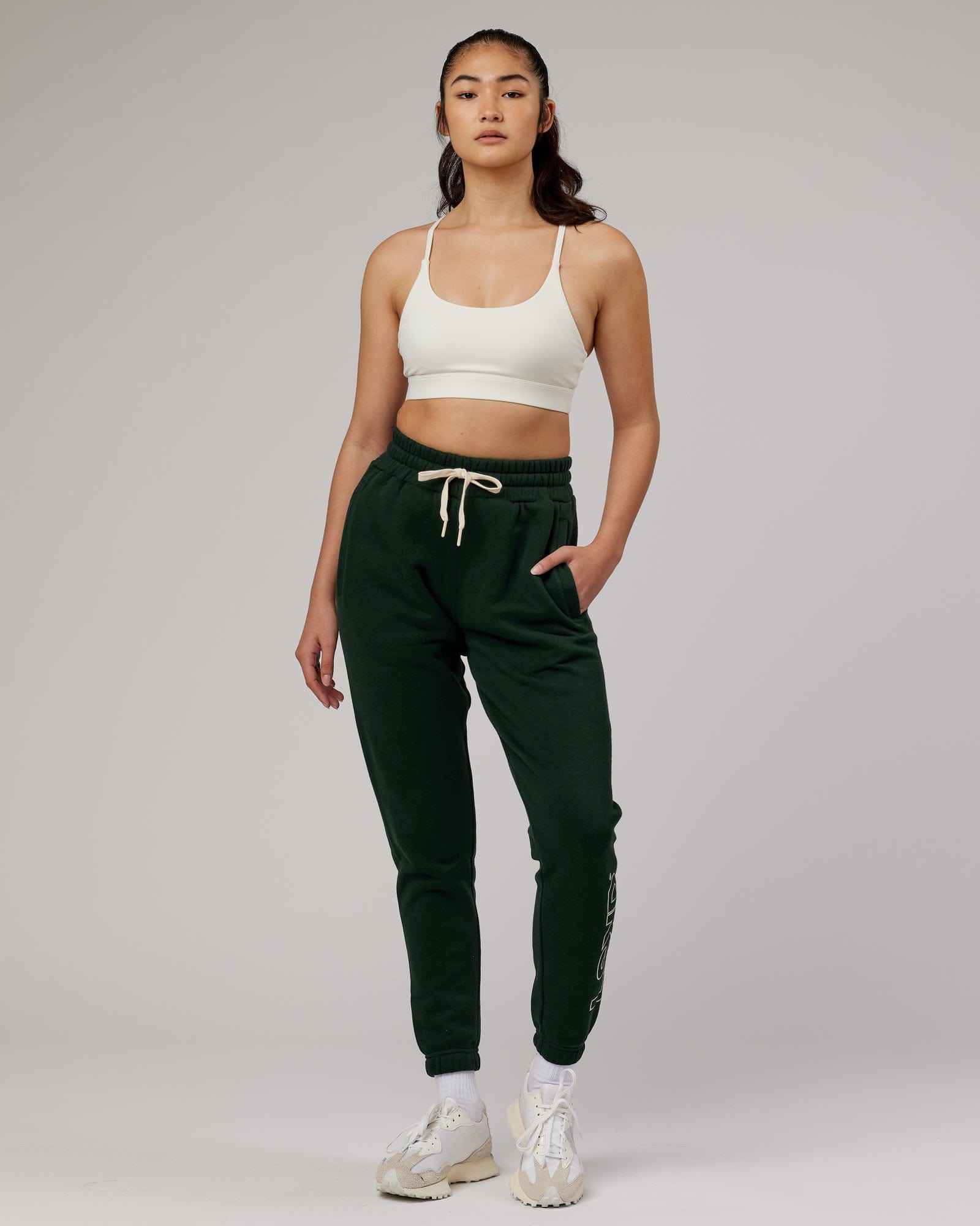 Model wearing Unisex Stacks Up Track Pant - Forest