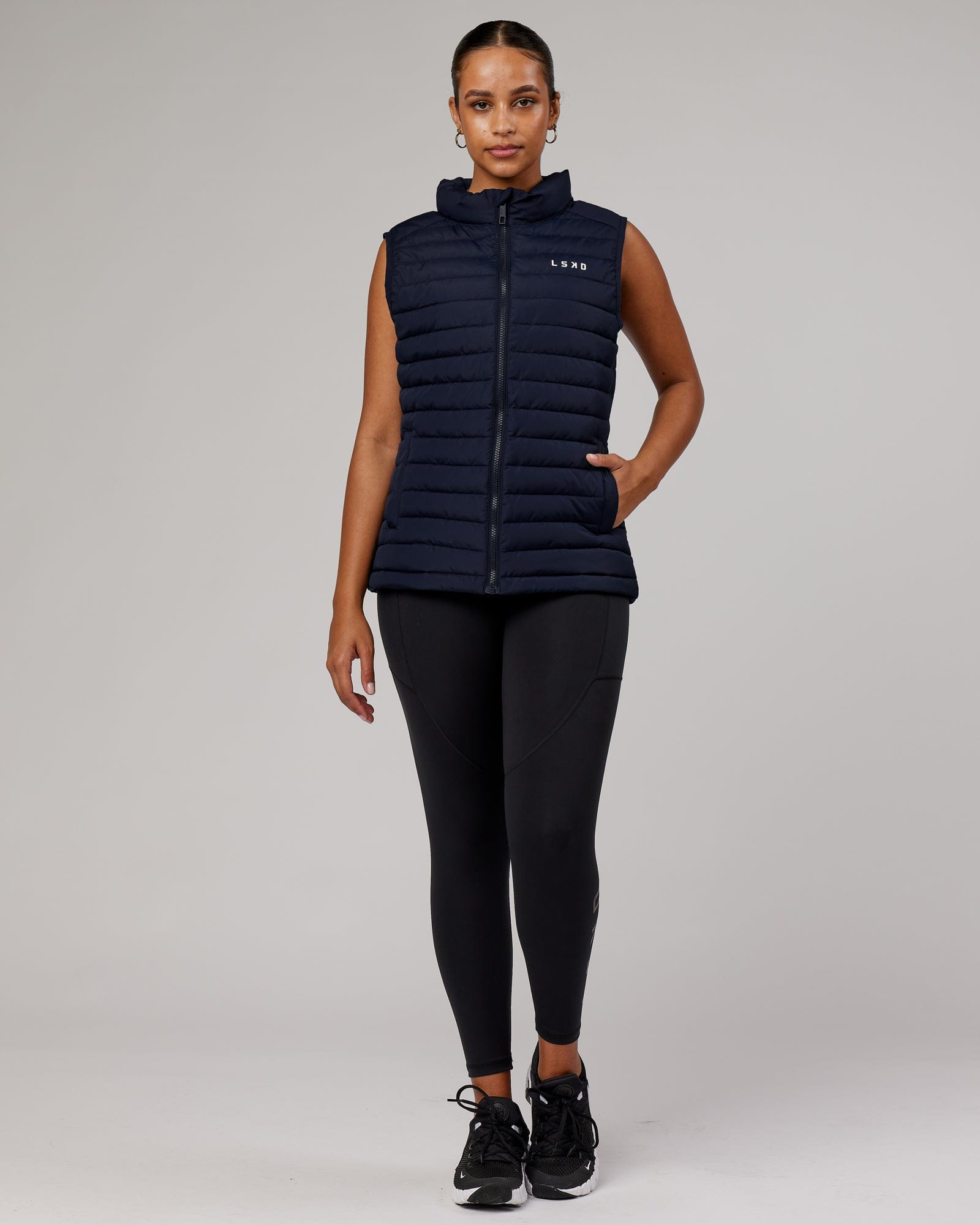 Model wearing Uplift Puffer Vest - Navy