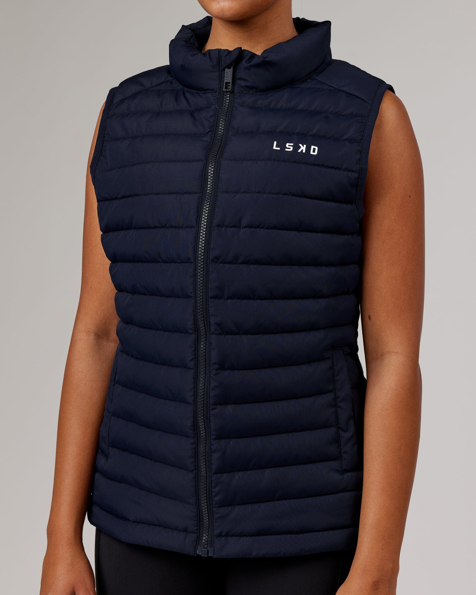 Model wearing Uplift Puffer Vest - Navy