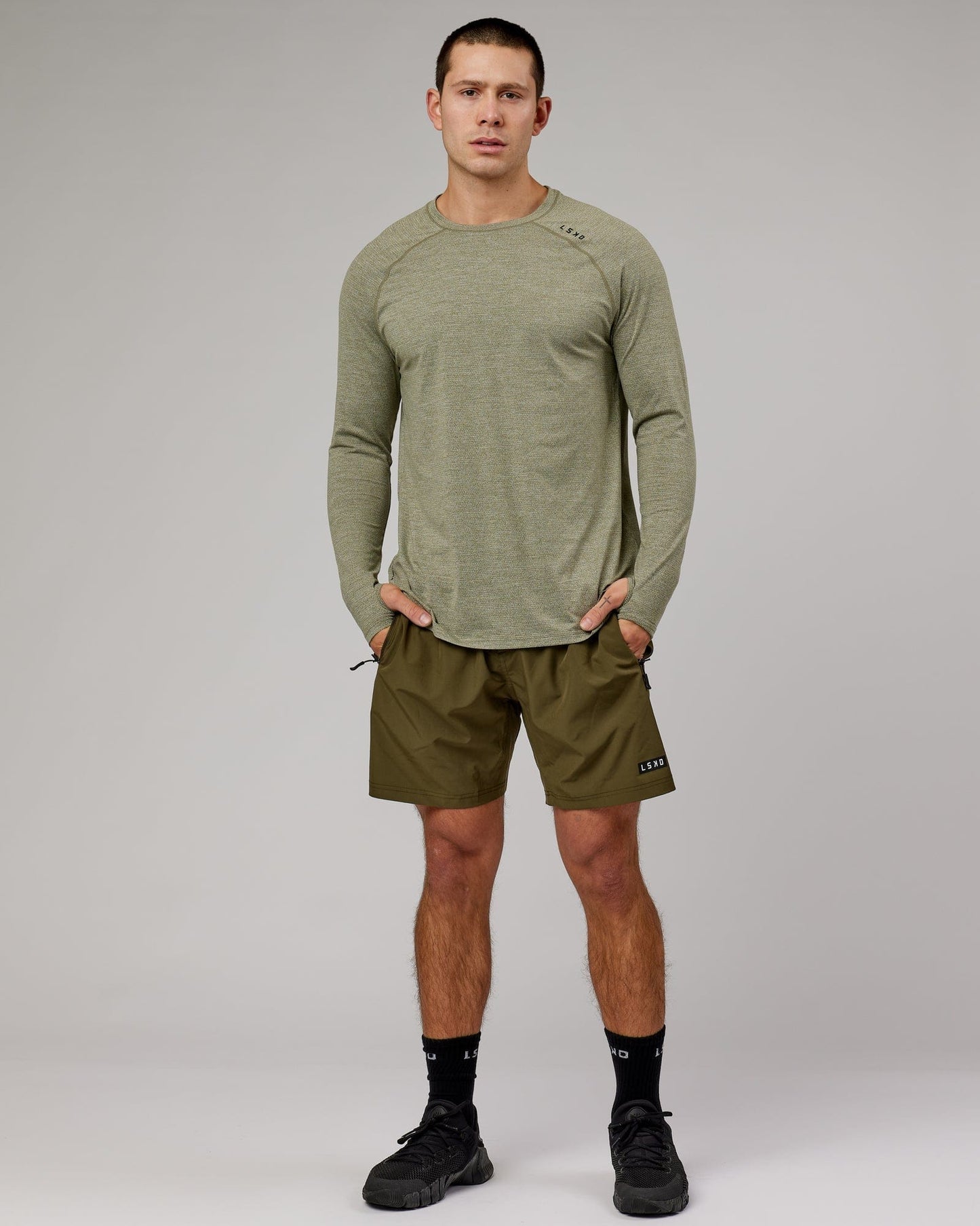 Model wearing Perform VapourFLX LS Tee - Olive Marl