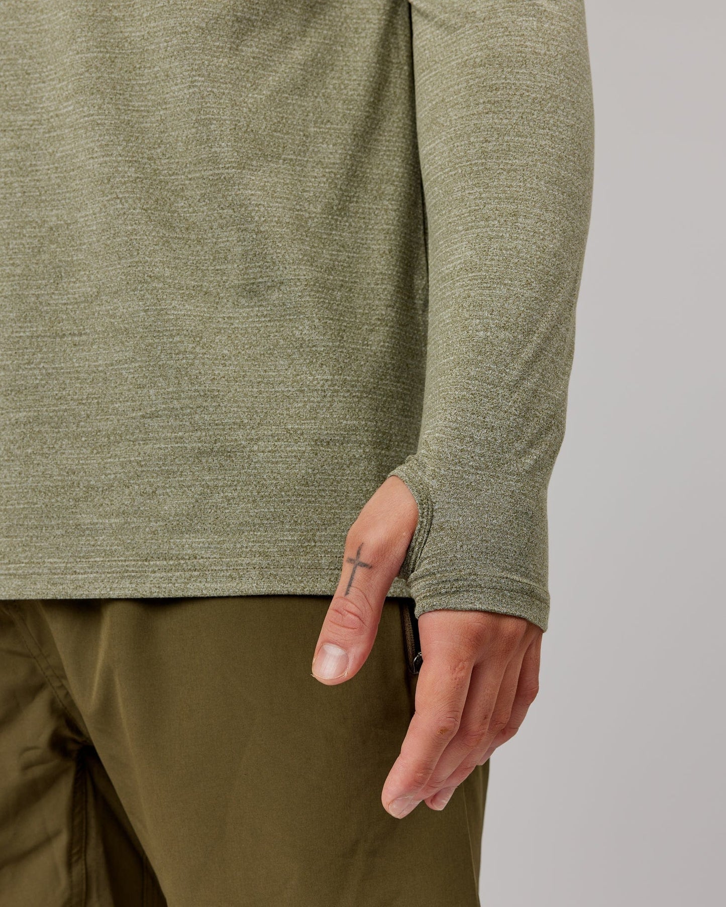 Model wearing Perform VapourFLX LS Tee - Olive Marl