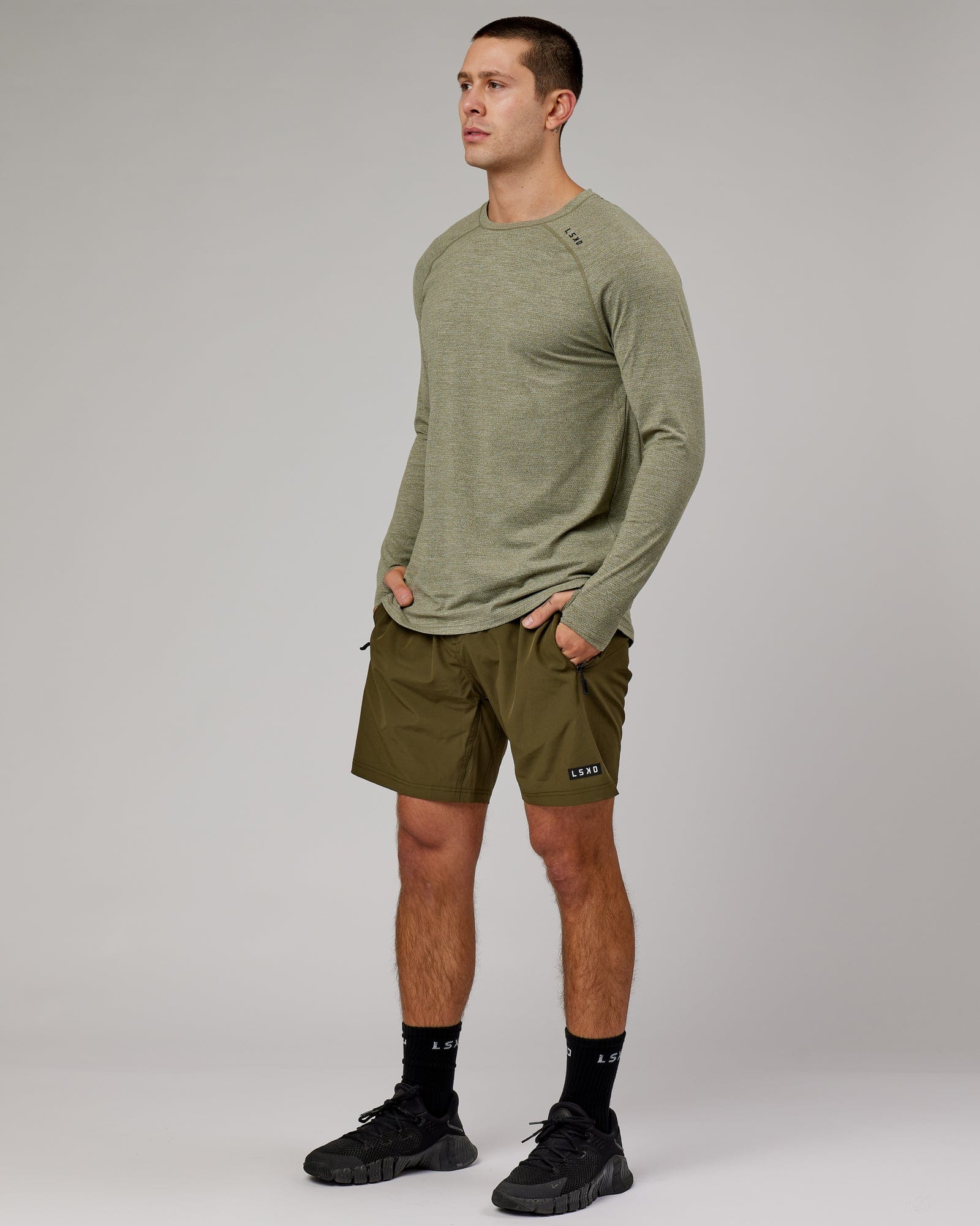 Model wearing Perform VapourFLX LS Tee - Olive Marl