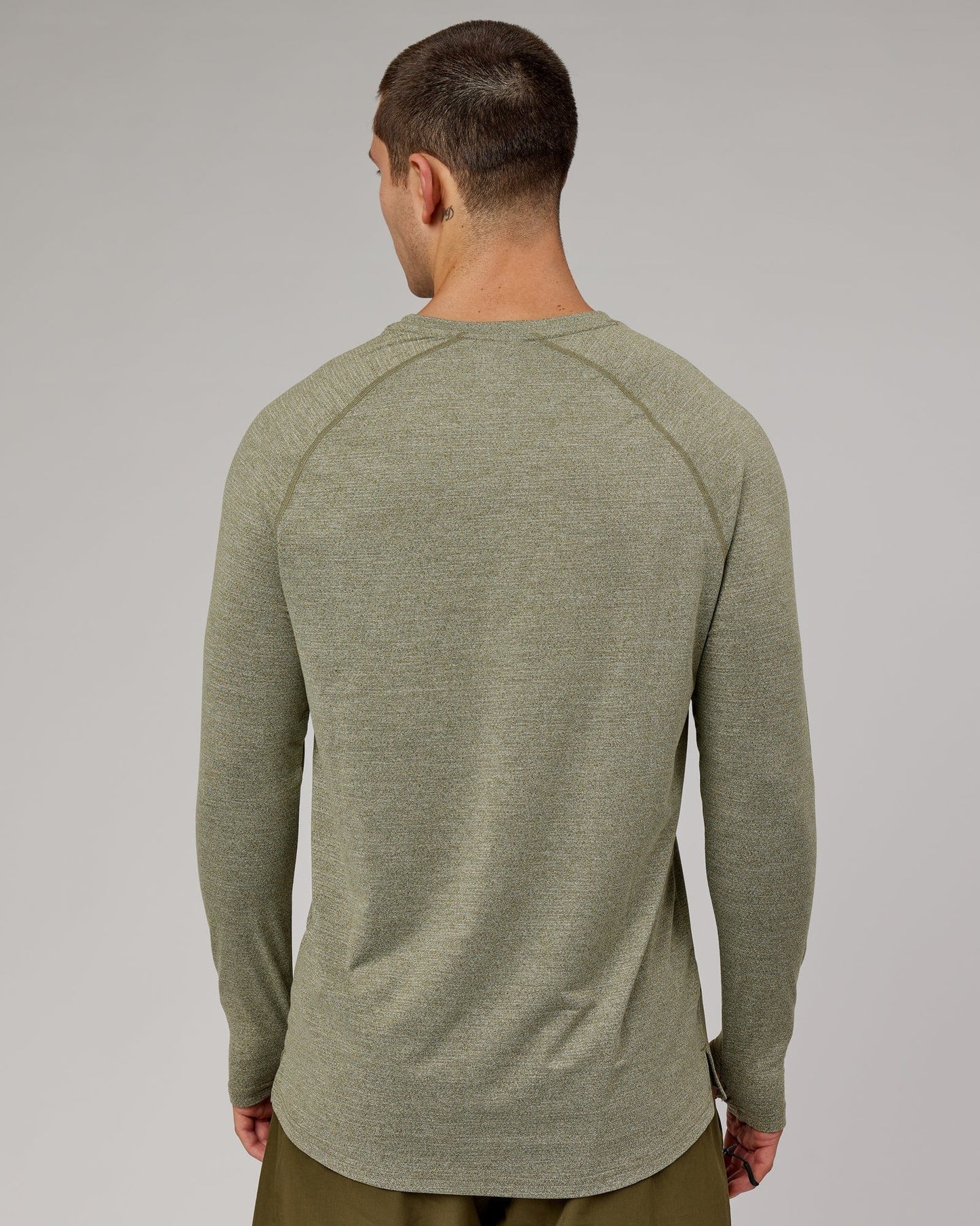 Model wearing Perform VapourFLX LS Tee - Olive Marl
