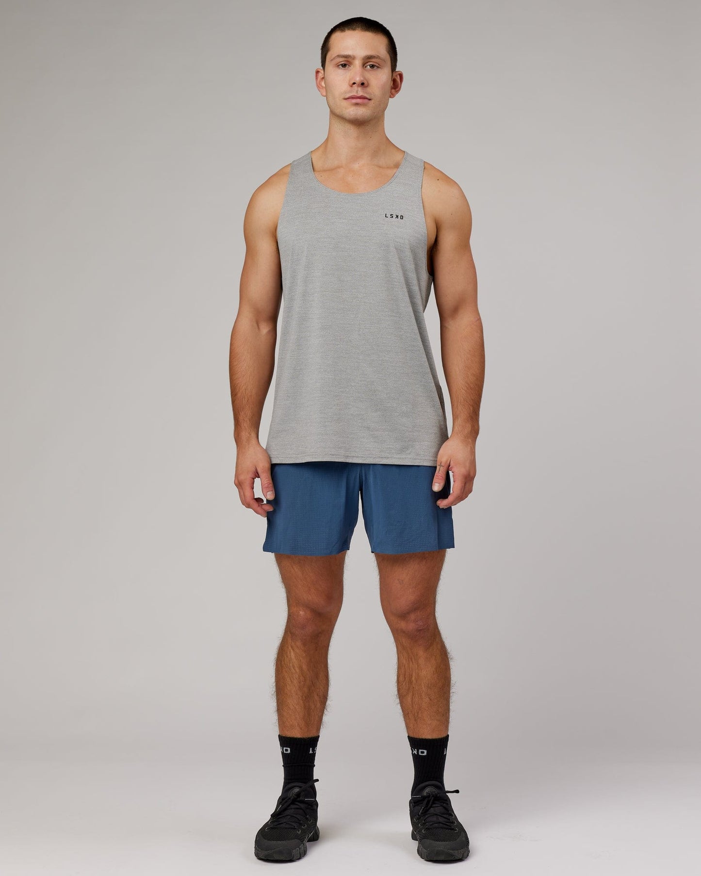 Model wearing Perform VapourFLX Tank - Lt Grey Marl