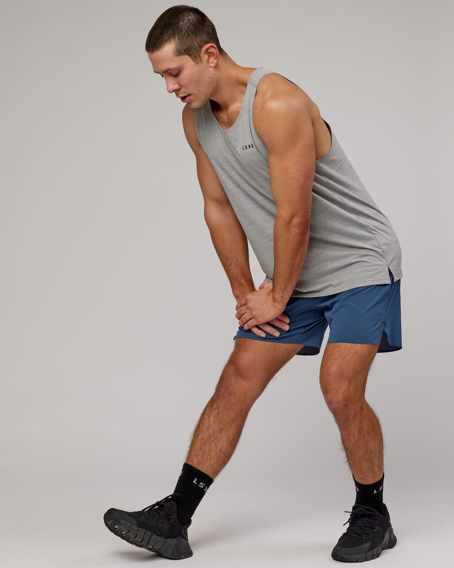 Model wearing Perform VapourFLX Tank - Lt Grey Marl
