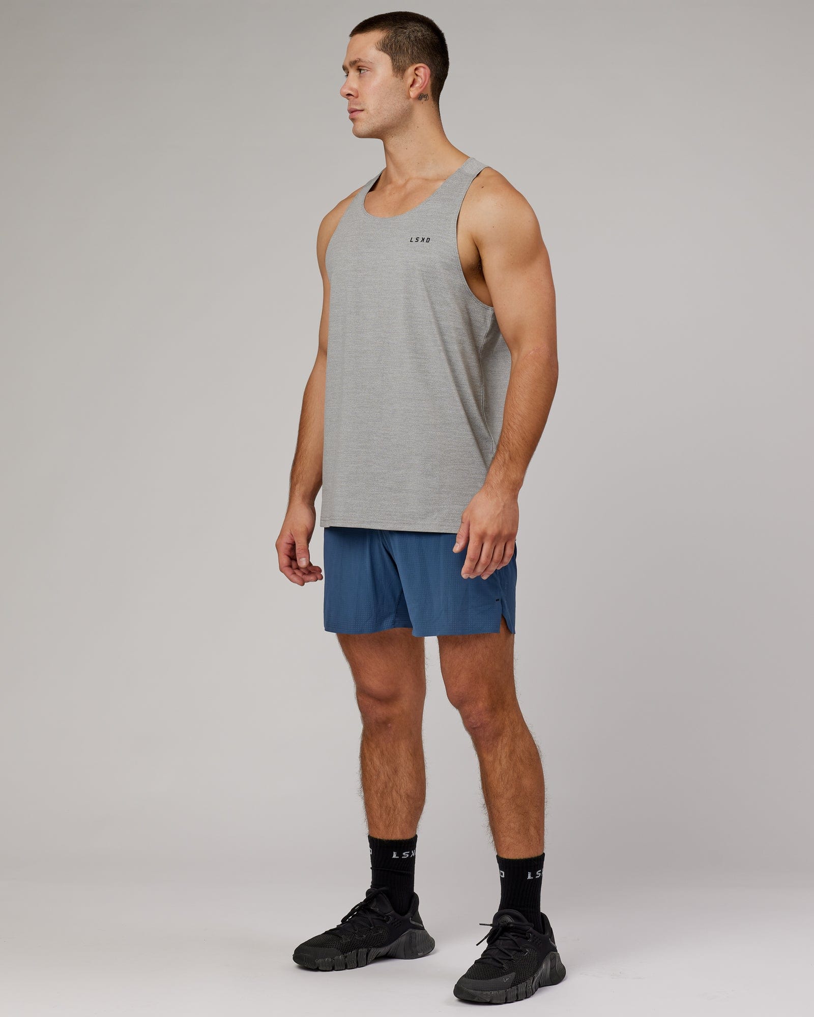 Model wearing Perform VapourFLX Tank - Lt Grey Marl
