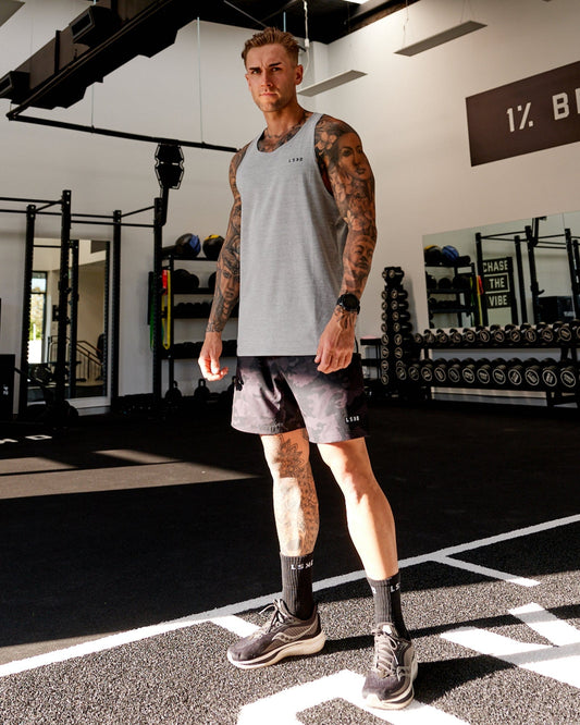 Model wearing Perform VapourFLX Tank - Lt Grey Marl