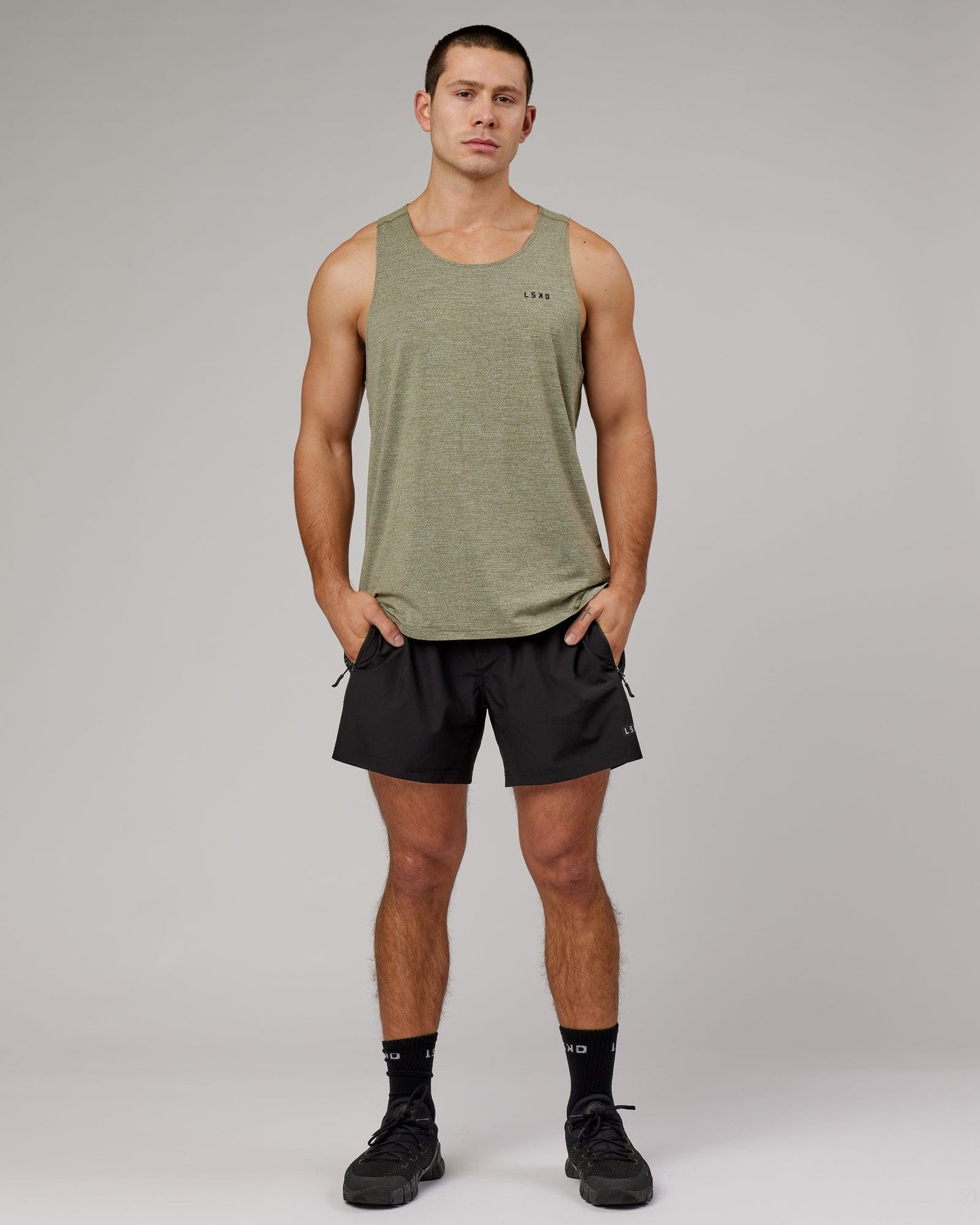 Model wearing Perform VapourFLX Tank - Olive Marl