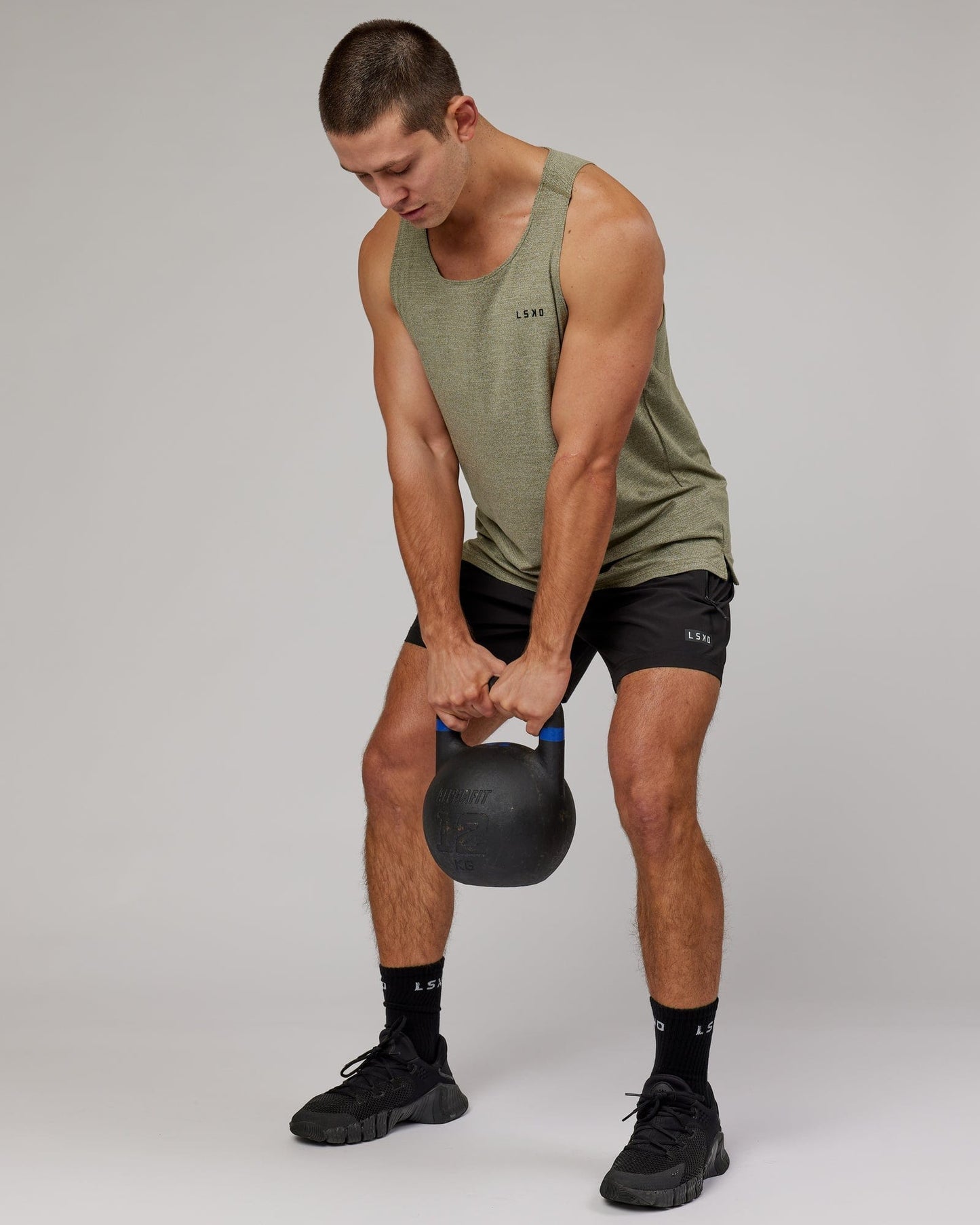 Model wearing Perform VapourFLX Tank - Olive Marl
