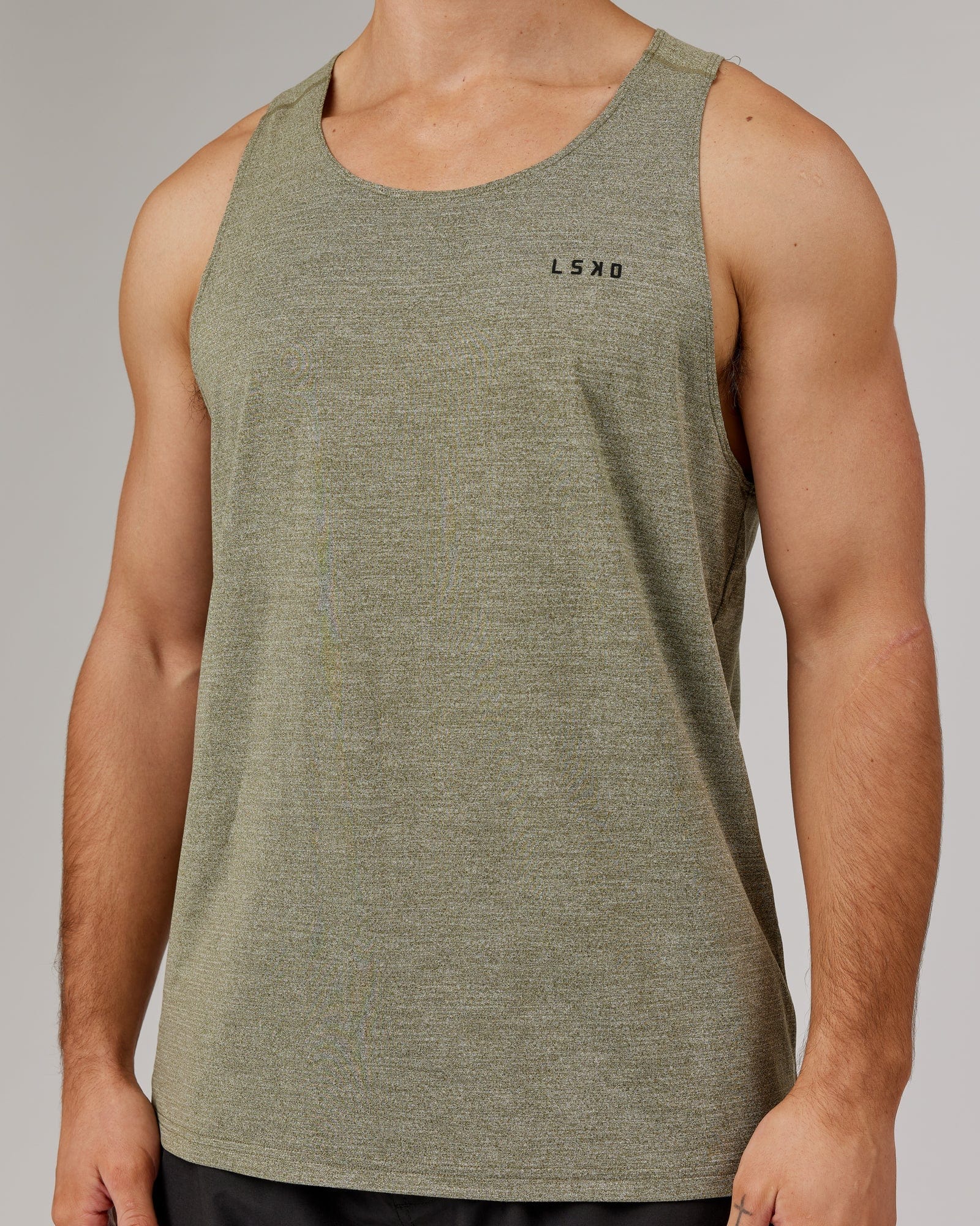 Model wearing Perform VapourFLX Tank - Olive Marl