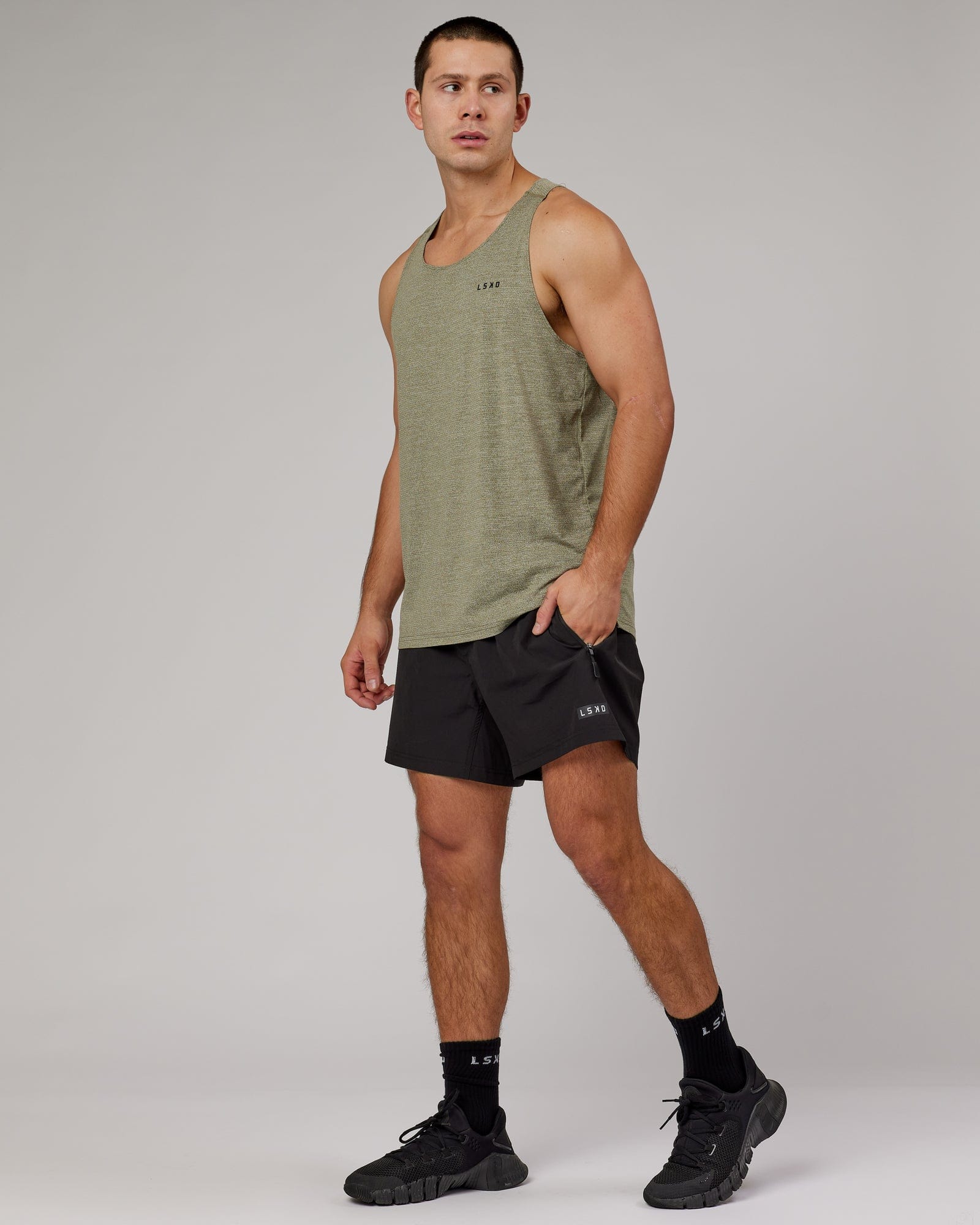 Model wearing Perform VapourFLX Tank - Olive Marl