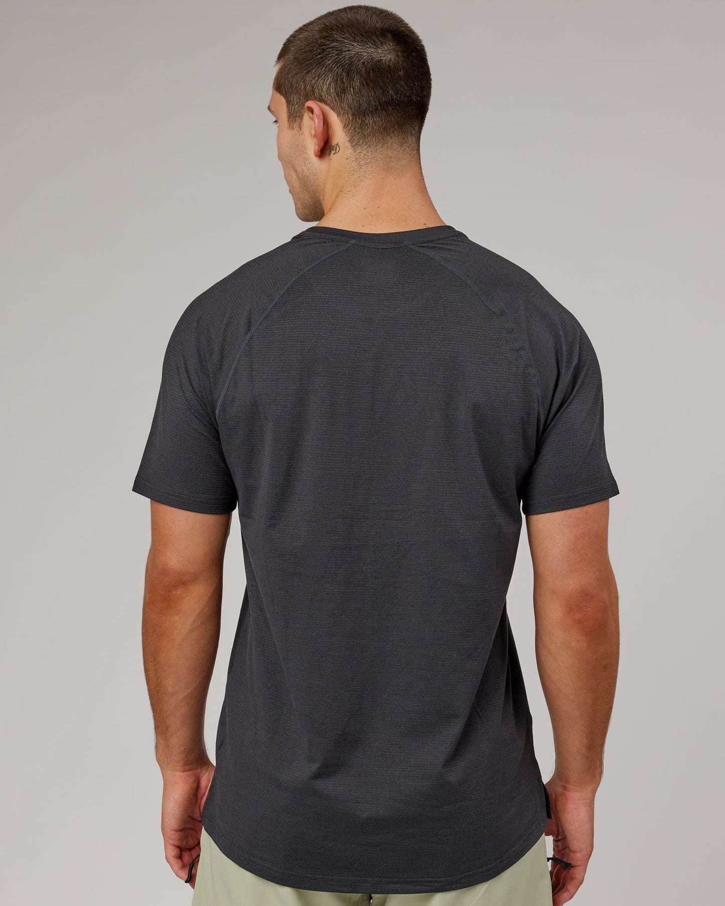 Model wearing Perform VapourFLX Tee - Black Marl