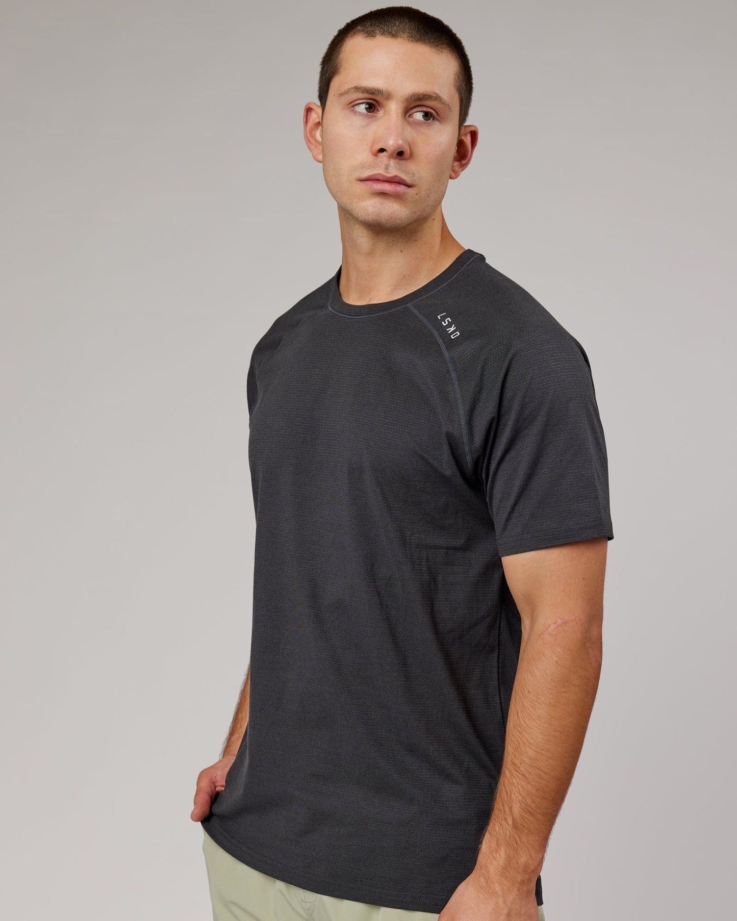 Model wearing Perform VapourFLX Tee - Black Marl
