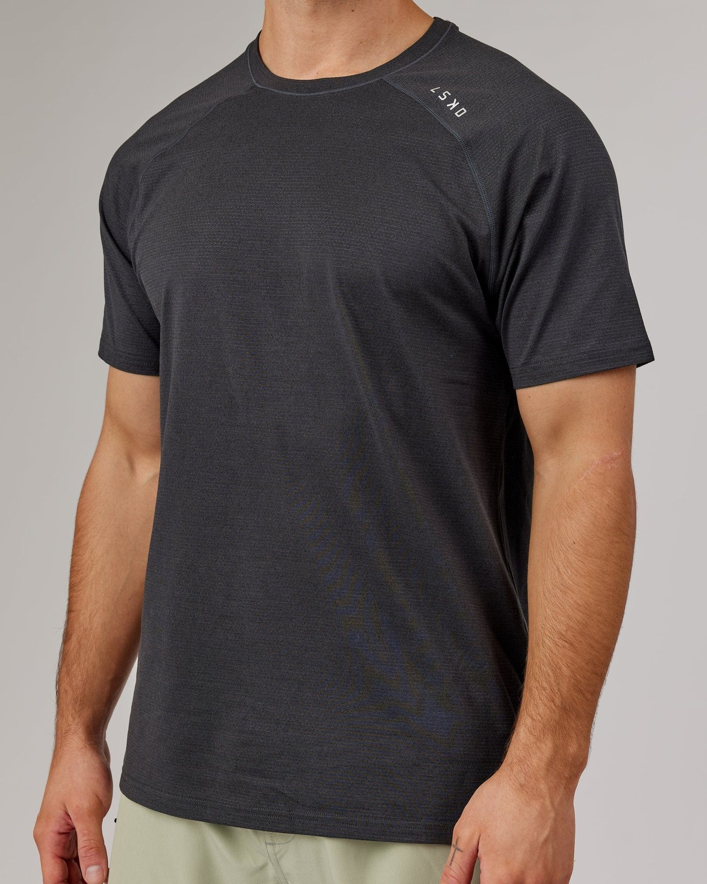 Model wearing Perform VapourFLX Tee - Black Marl