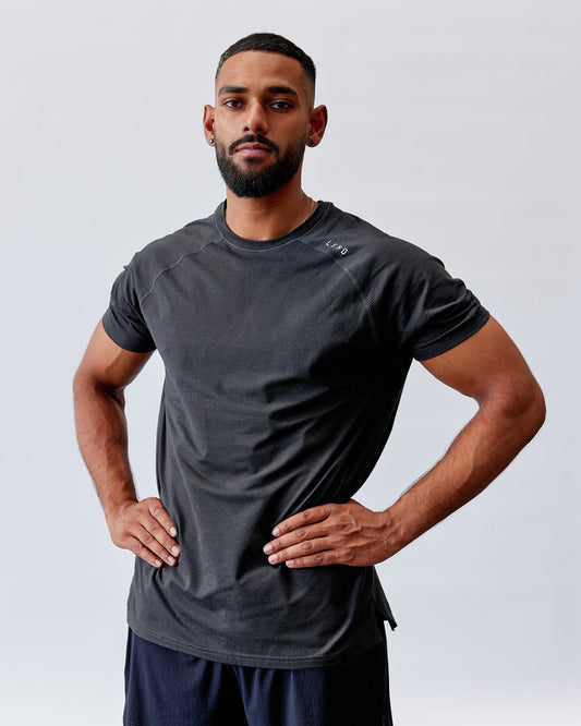 Model wearing Perform VapourFLX Tee - Black Marl