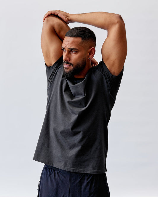 Model wearing Perform VapourFLX Tee - Black Marl