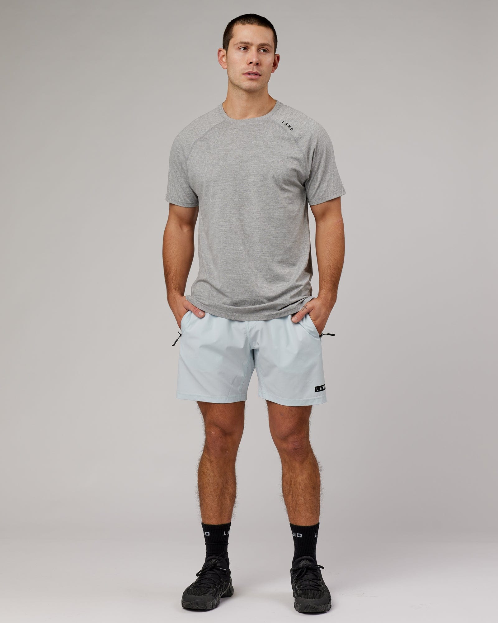 Model wearing Perform VapourFLX Tee - Lt Grey Marl