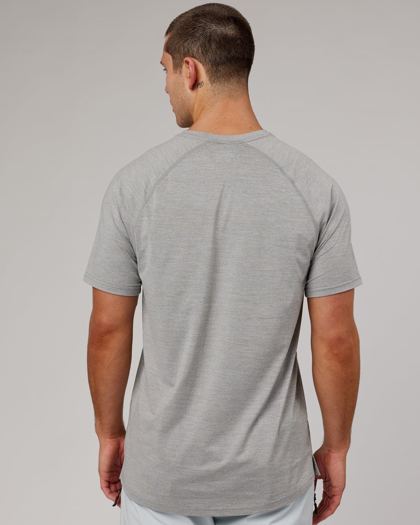 Model wearing Perform VapourFLX Tee - Lt Grey Marl