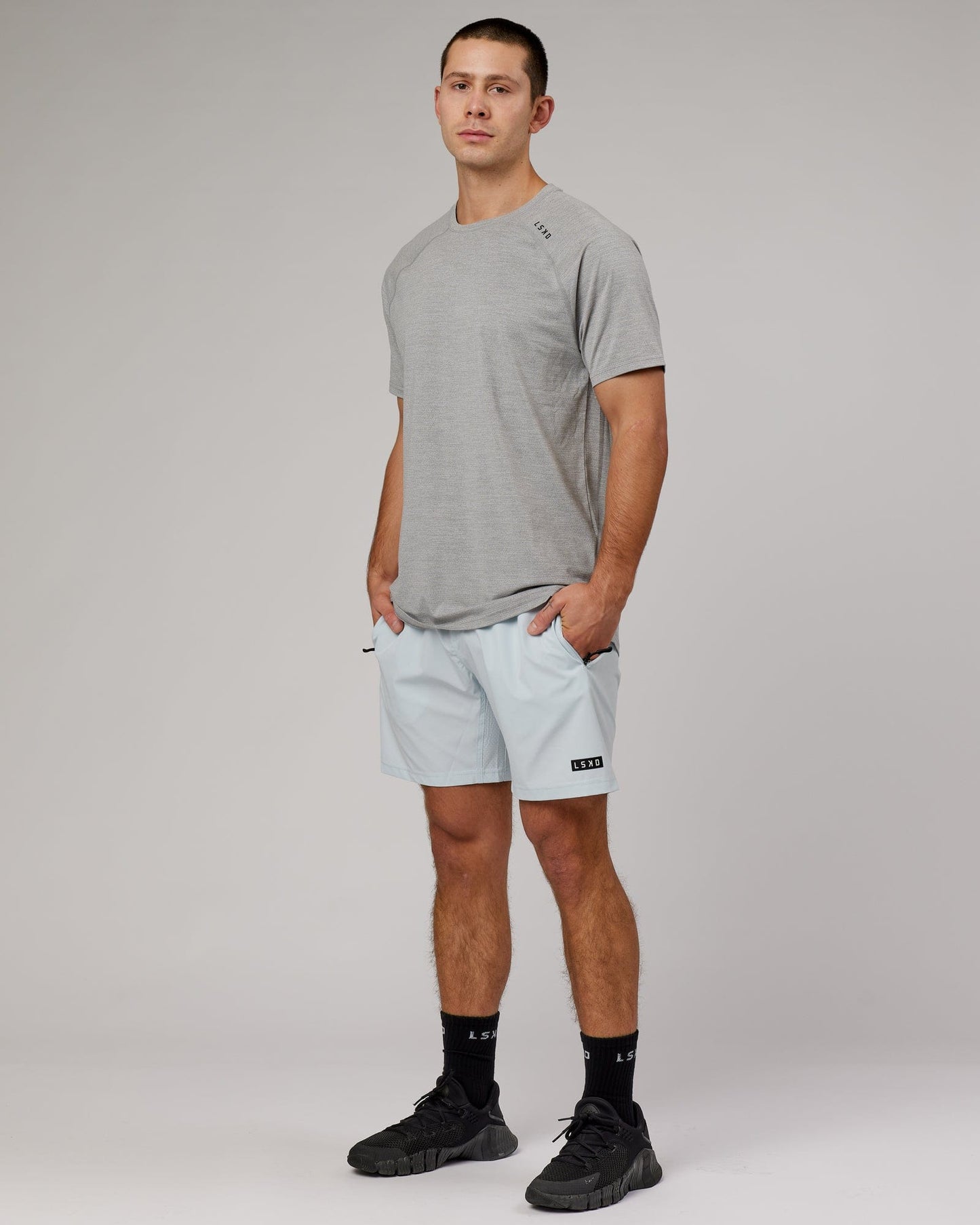 Model wearing Perform VapourFLX Tee - Lt Grey Marl