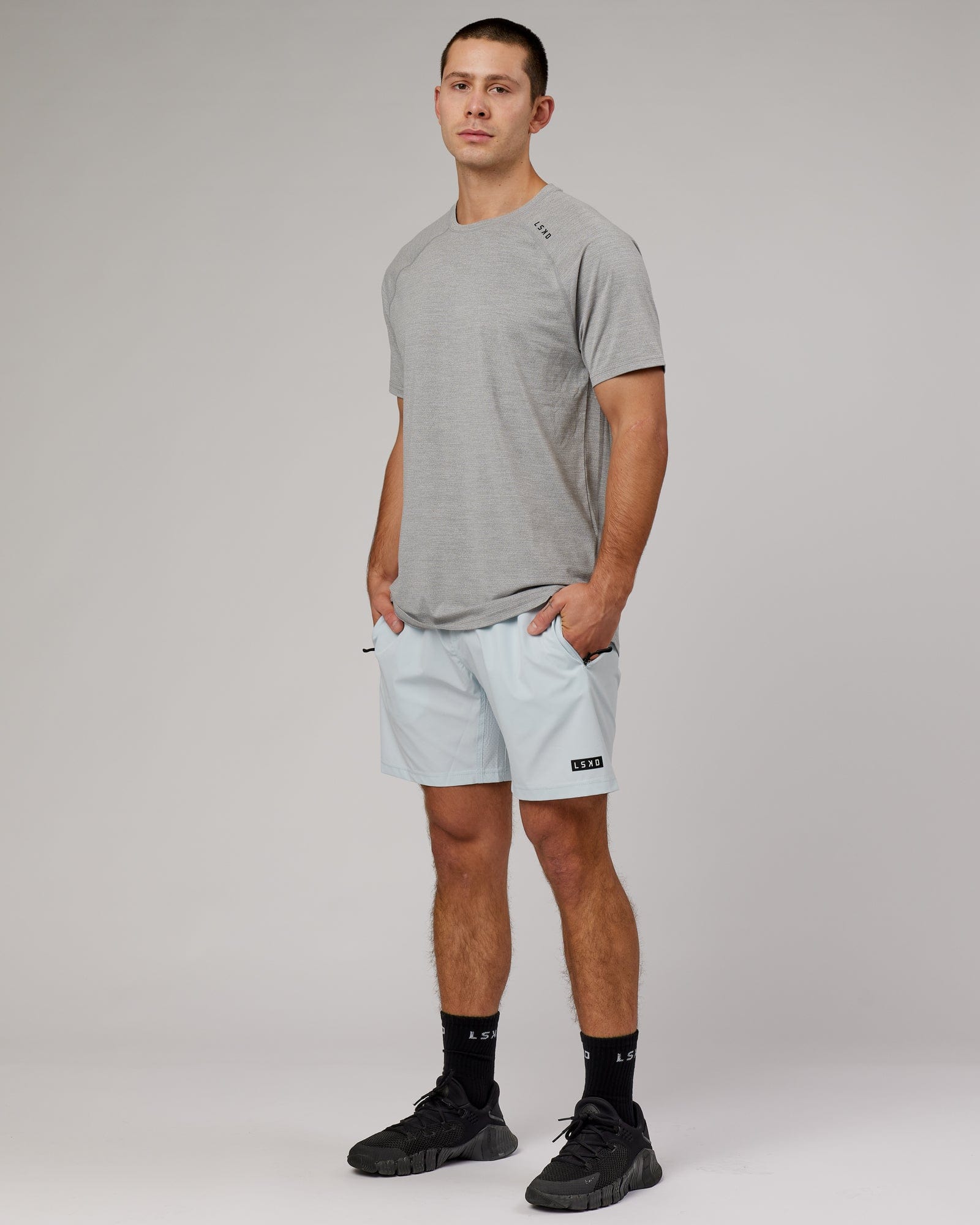 Model wearing Perform VapourFLX Tee - Lt Grey Marl