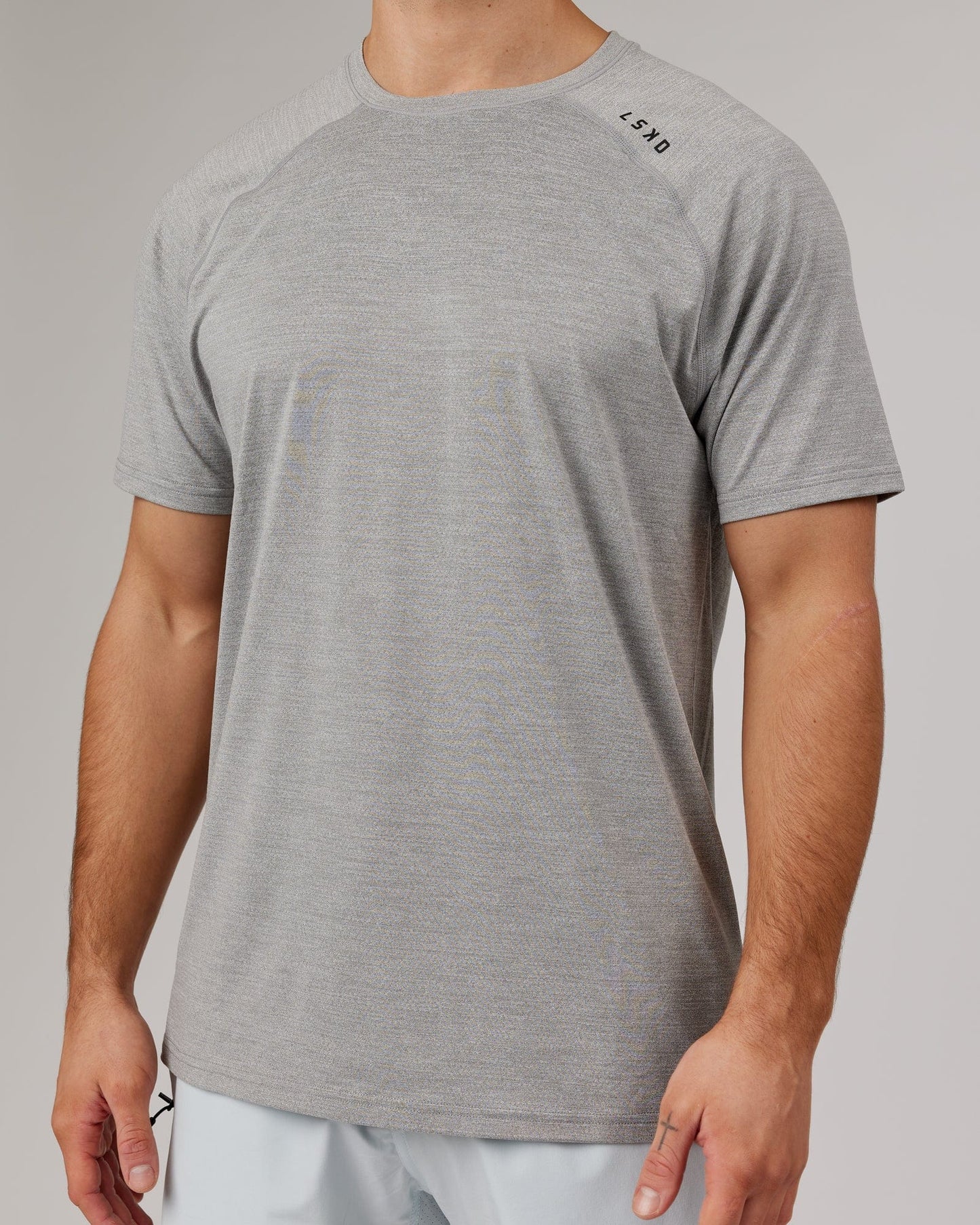 Model wearing Perform VapourFLX Tee - Lt Grey Marl