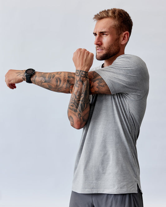 Model wearing Perform VapourFLX Tee - Lt Grey Marl