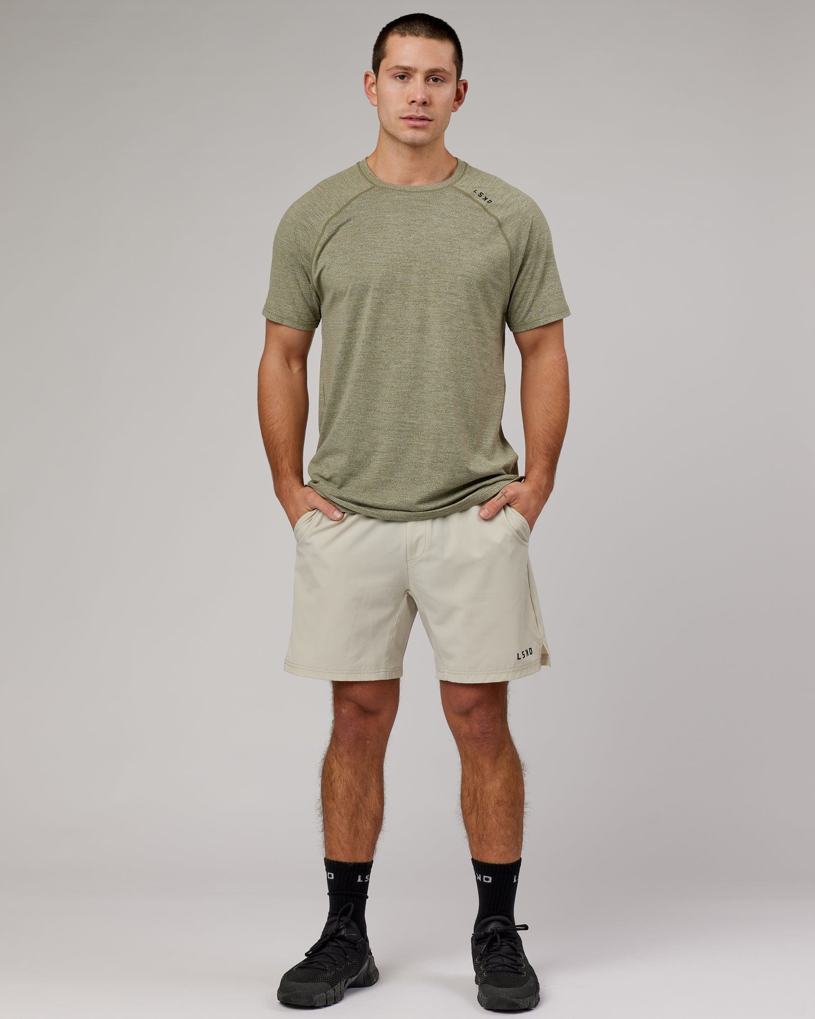 Model wearing Perform VapourFLX Tee - Olive Marl