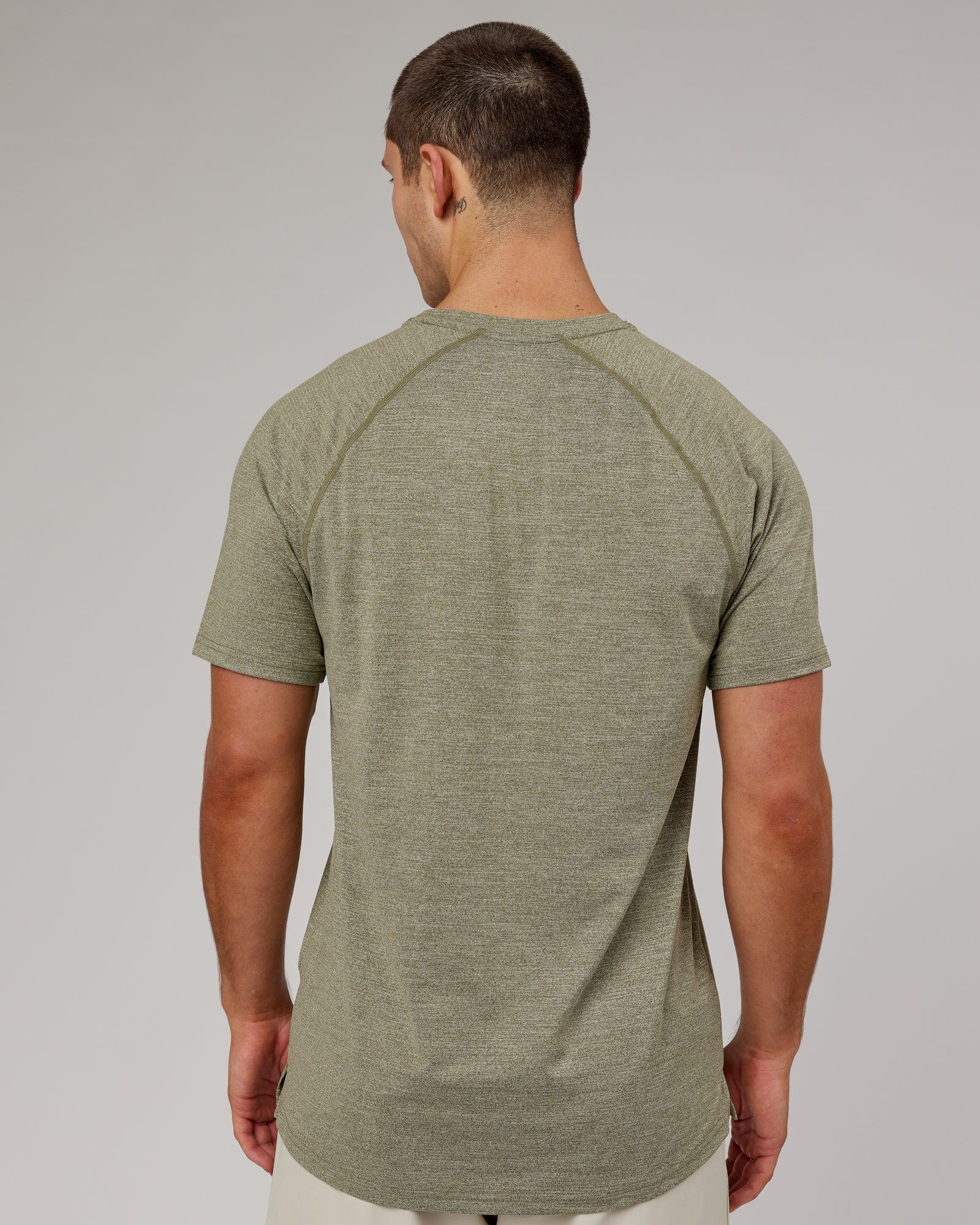 Model wearing Perform VapourFLX Tee - Olive Marl