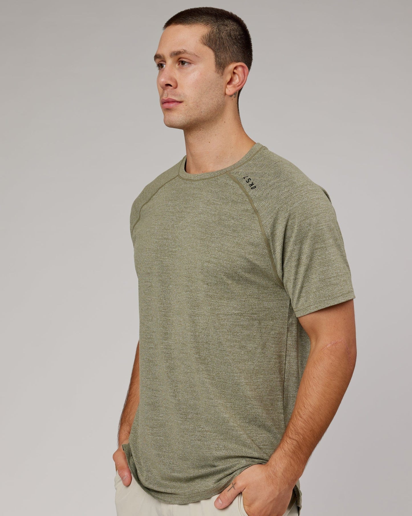 Model wearing Perform VapourFLX Tee - Olive Marl