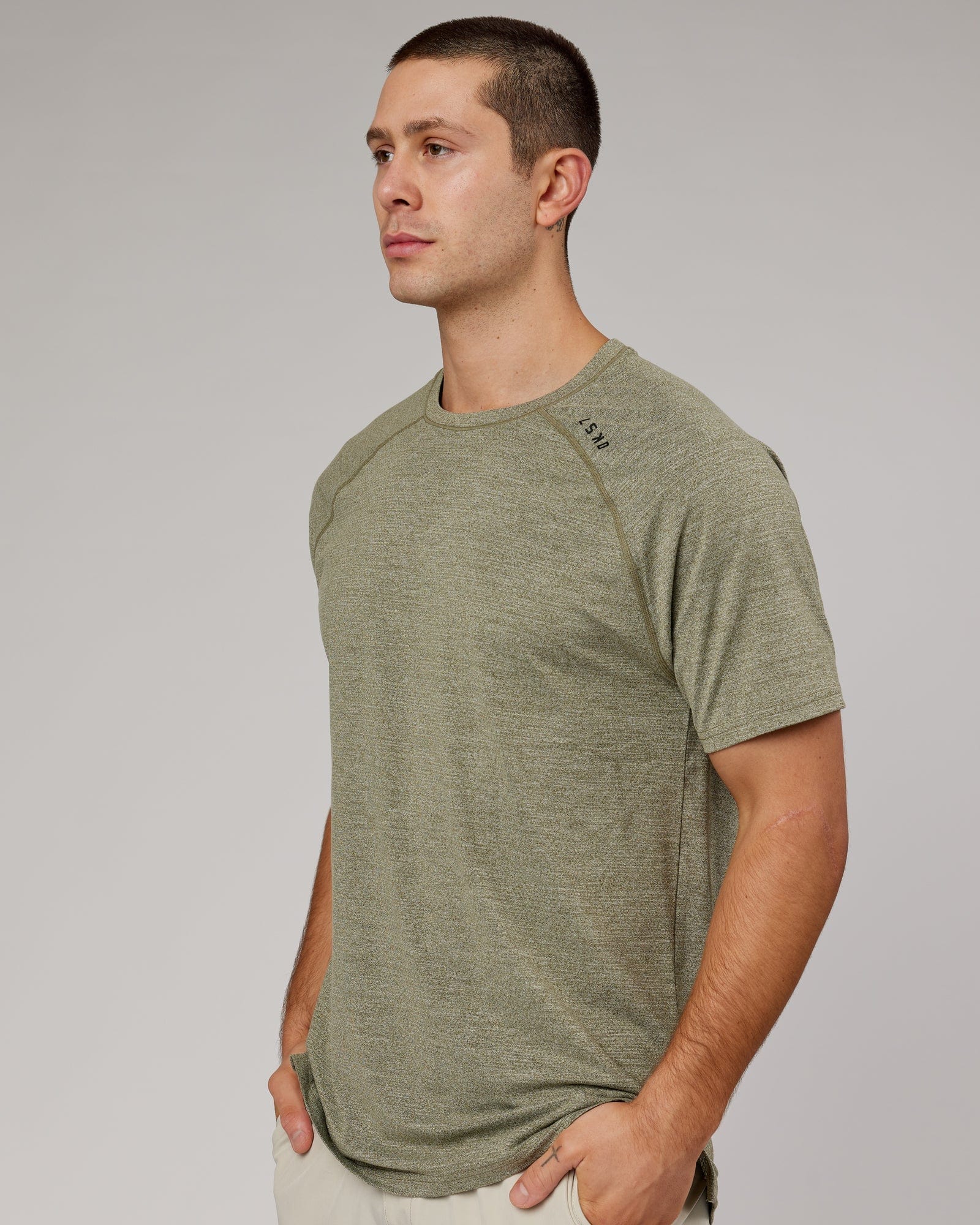 Model wearing Perform VapourFLX Tee - Olive Marl