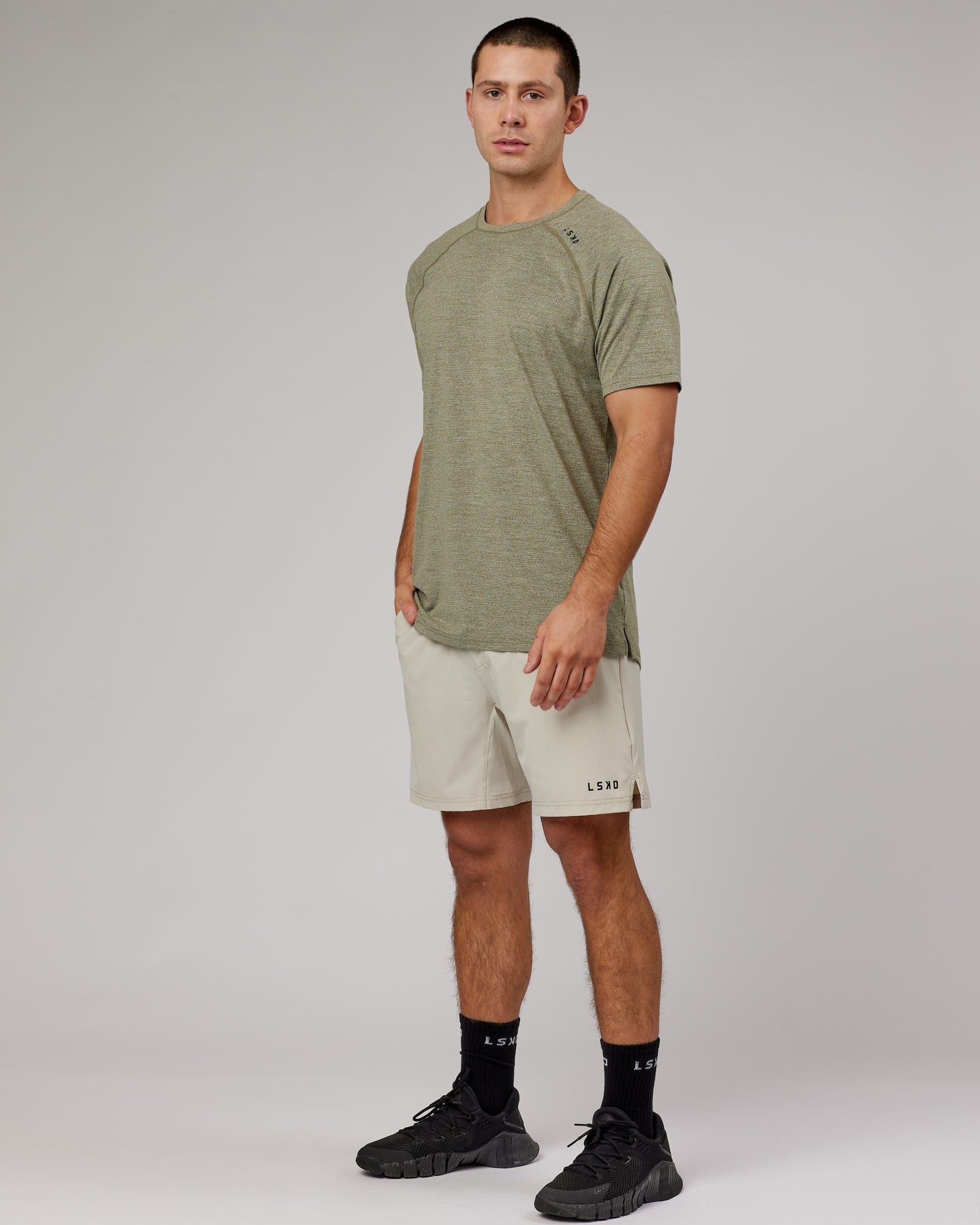 Model wearing Perform VapourFLX Tee - Olive Marl