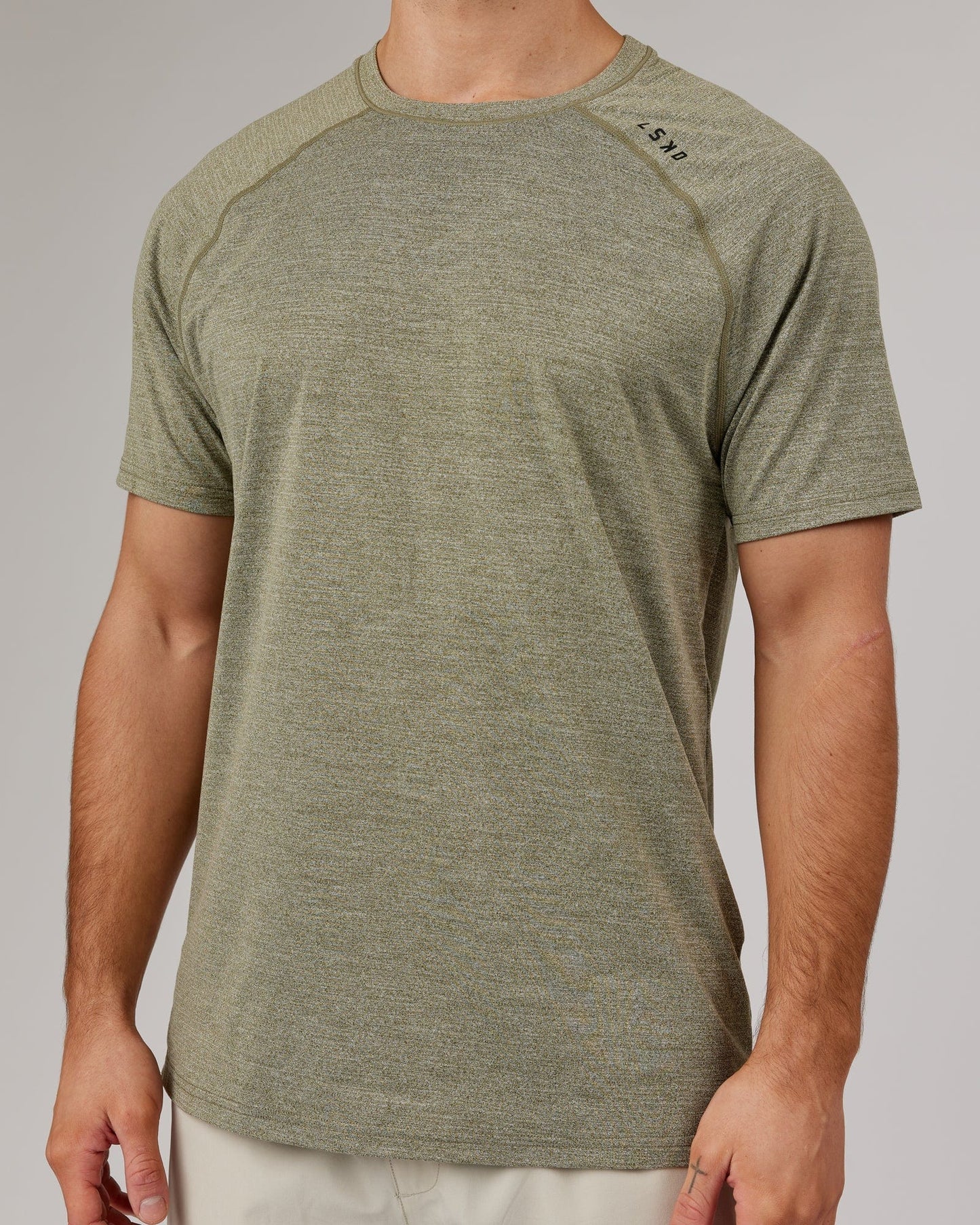 Model wearing Perform VapourFLX Tee - Olive Marl