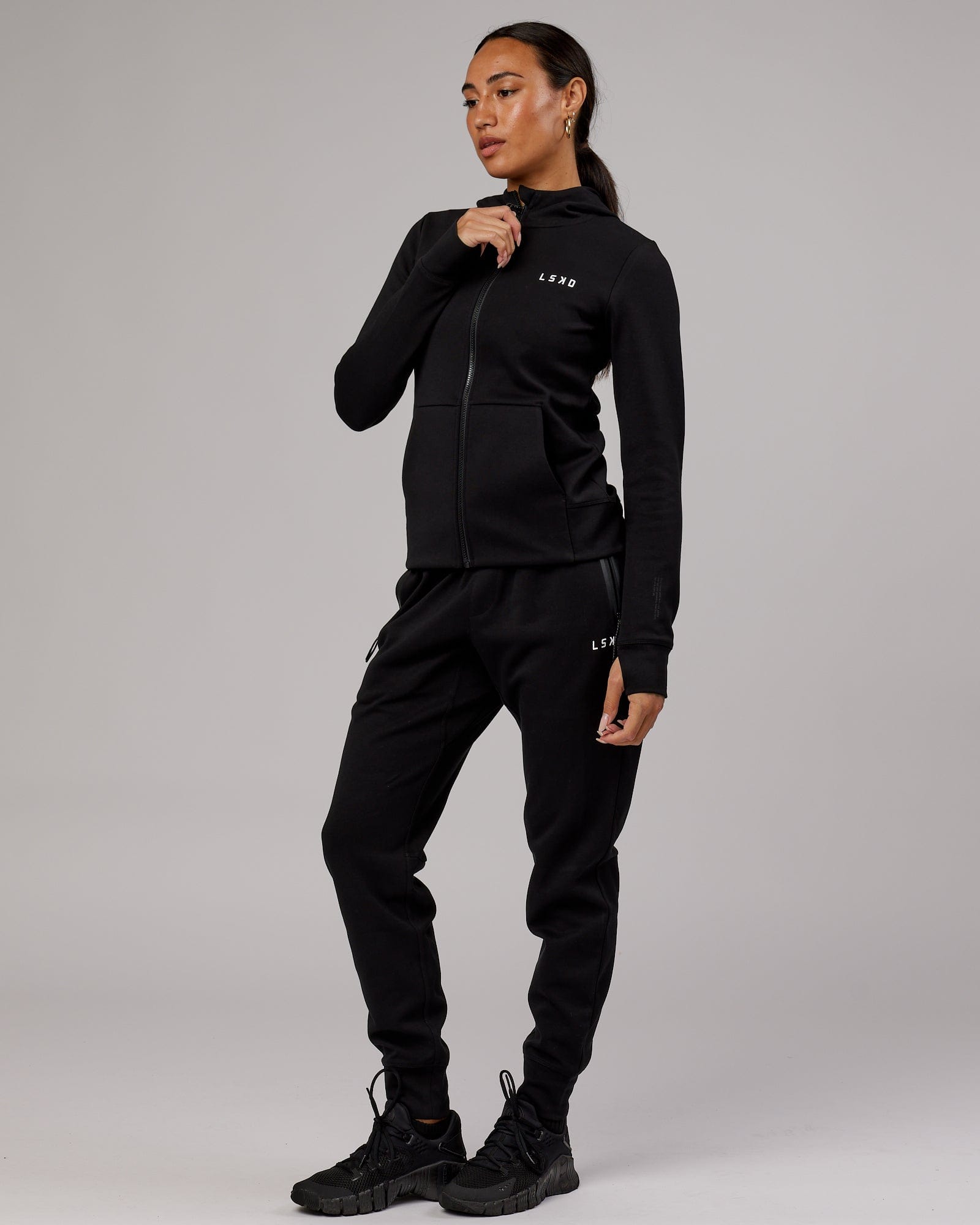 Model wearing Womens Athlete ForgedFleece Trackpant - Black