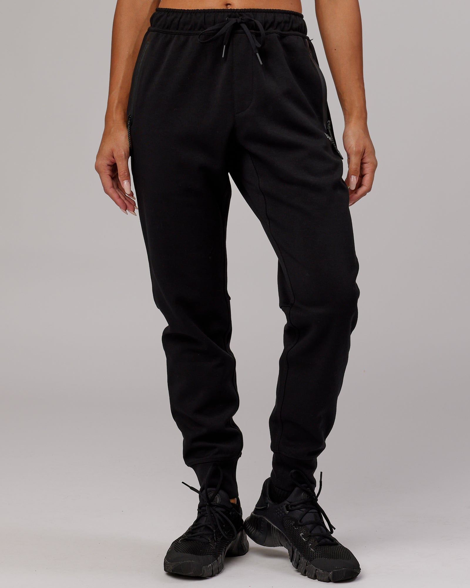 Model wearing Womens Athlete ForgedFleece Trackpant - Black