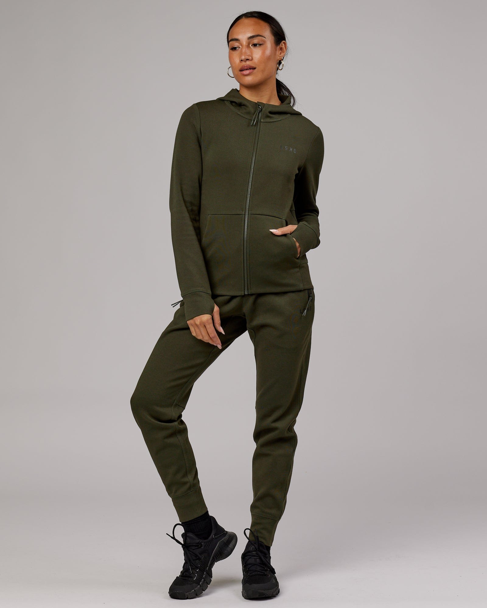 Model wearing Womens Athlete ForgedFleece Trackpant - Forest Night