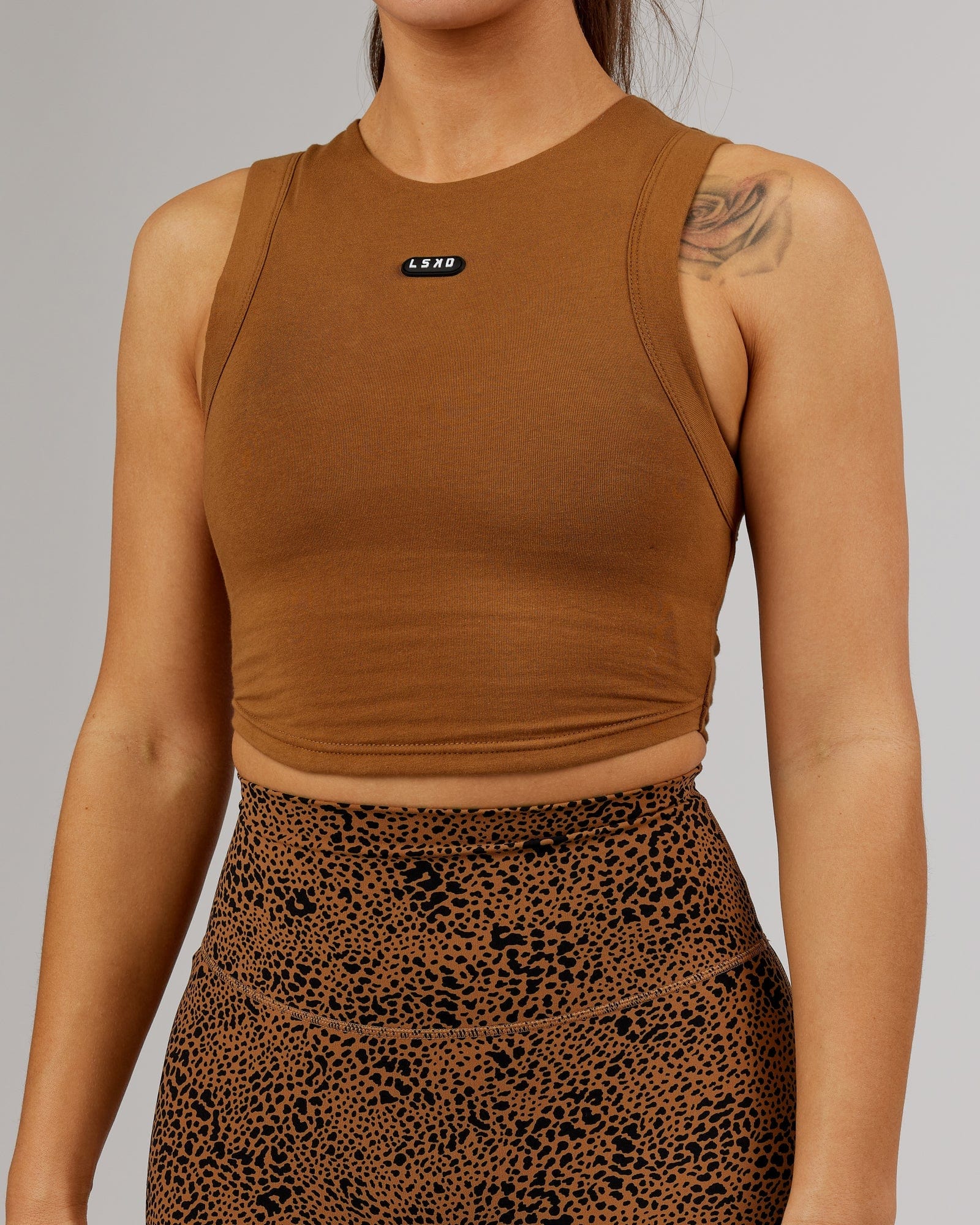 Model wearing Capsule Tank - Camel