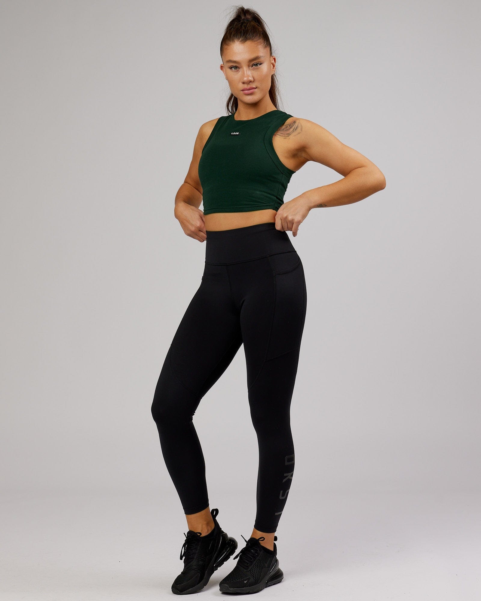 Model wearing Capsule Tank - Forest