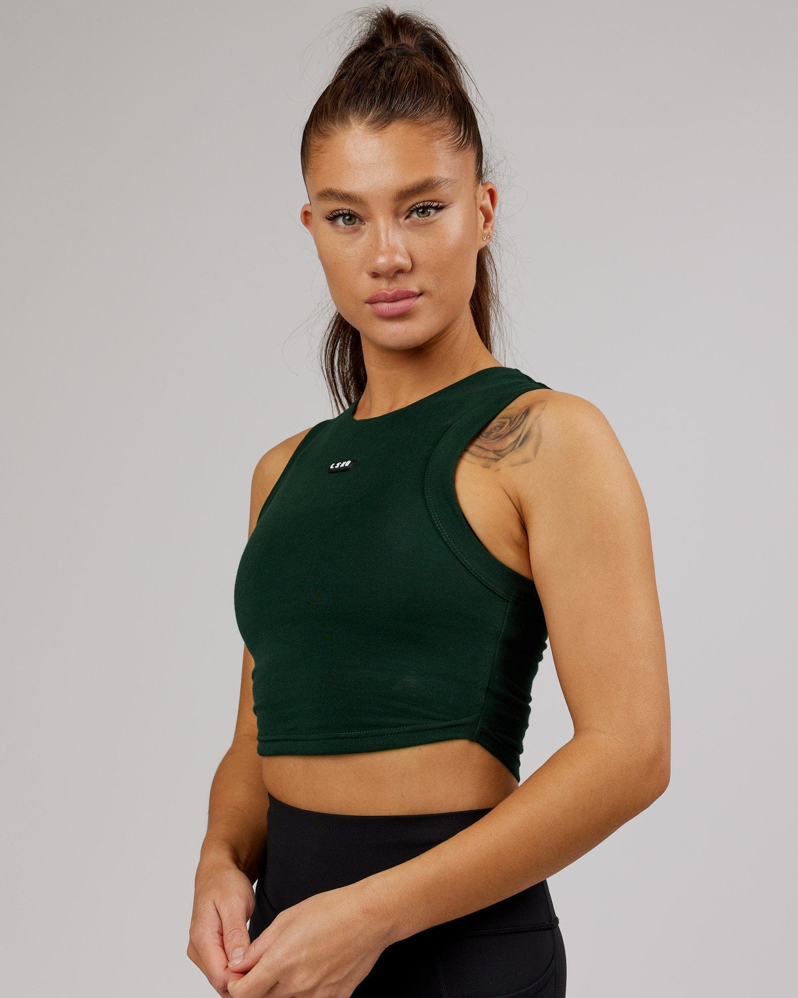 Model wearing Capsule Tank - Forest