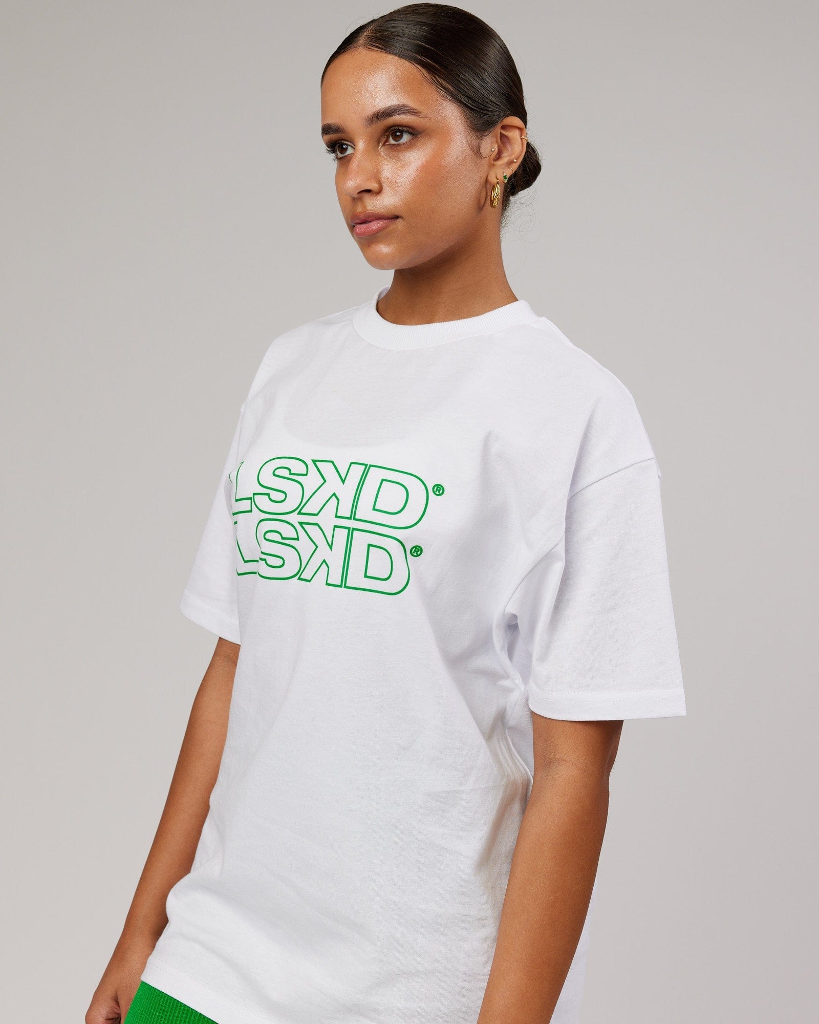Model wearing Unisex Stacks Up Heavyweight Oversize Tee - White-Vivid Green
