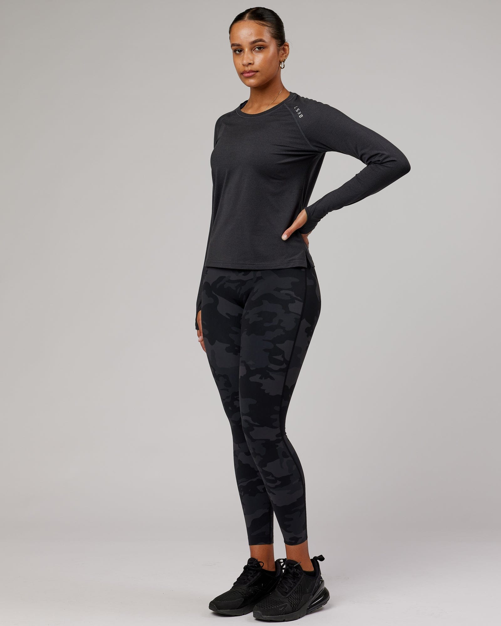 Model wearing Perform VapourFLX LS Tee - Black Marl