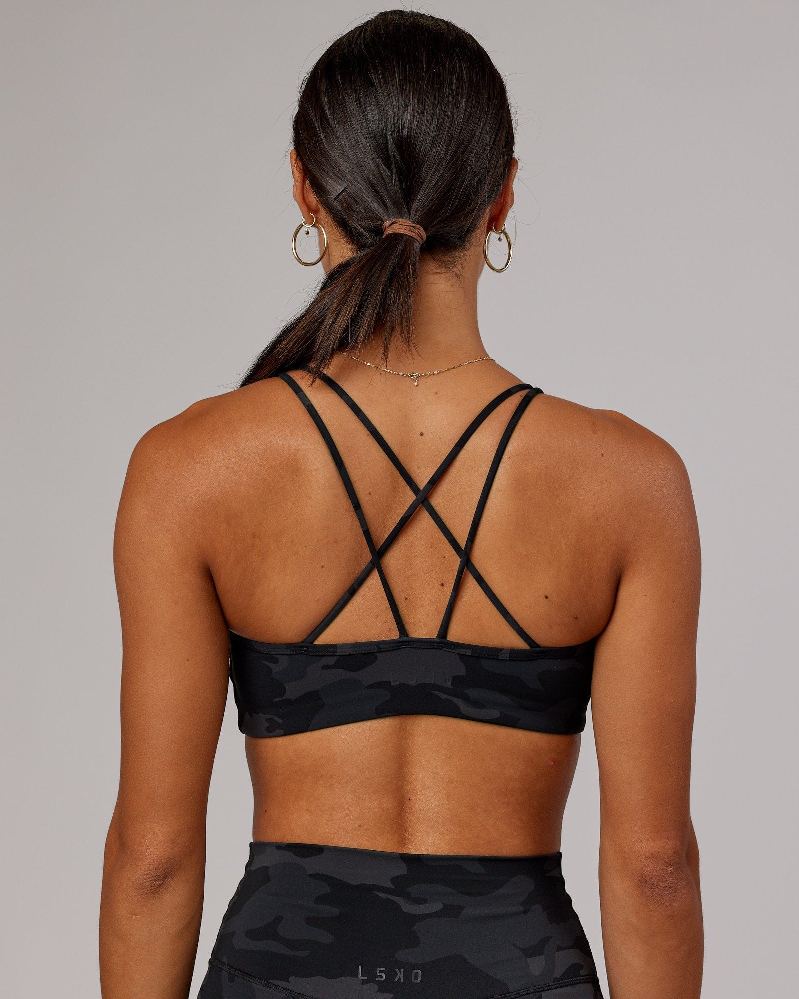Model wearing Yin Sports Bra - Black Camo