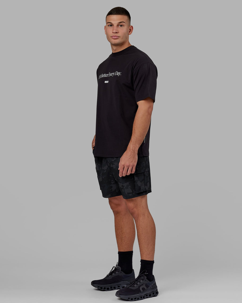 Man wearing Unisex 1% Better FLXCotton Tee Oversize - Black