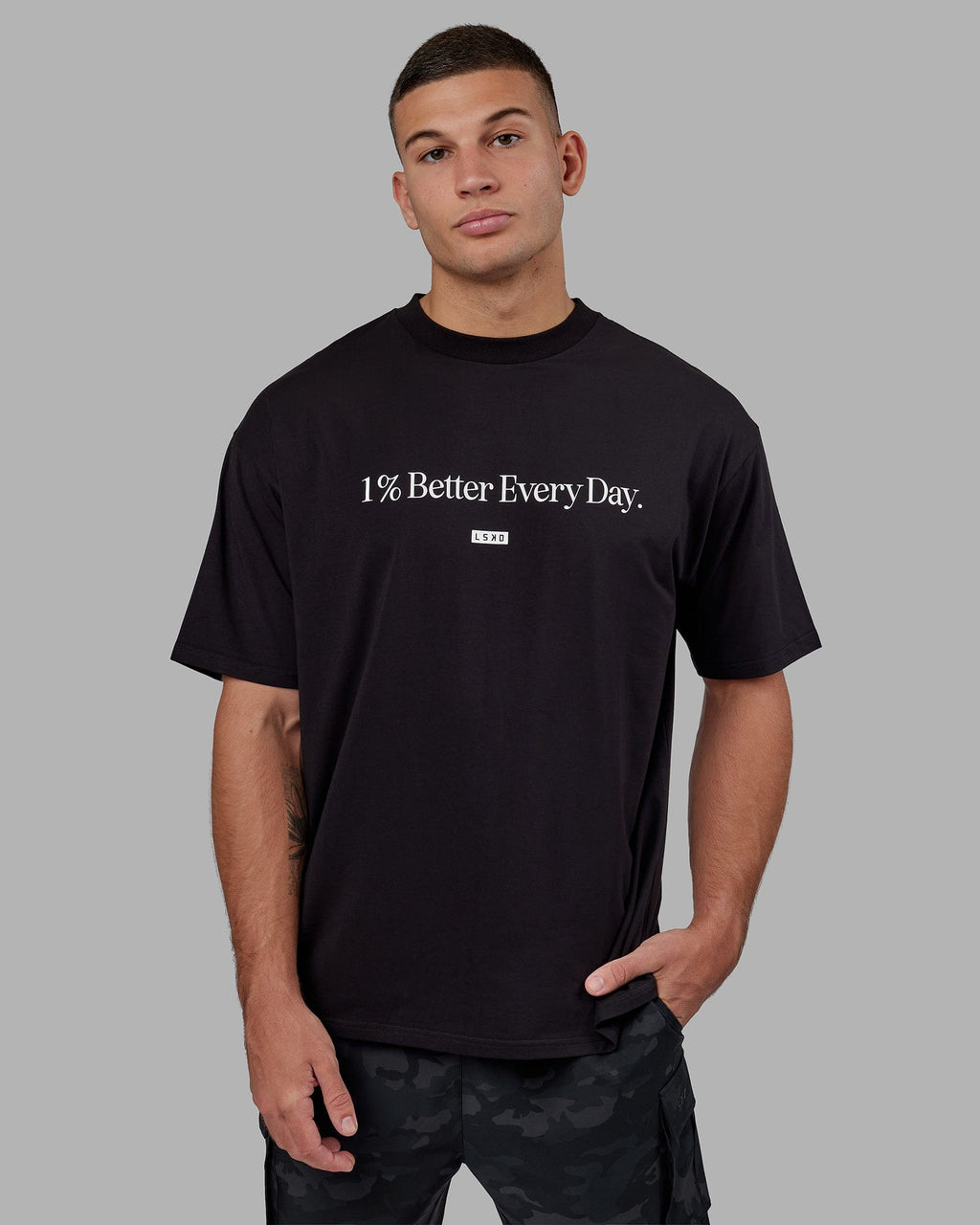 Man wearing Unisex 1% Better FLXCotton Tee Oversize - Black