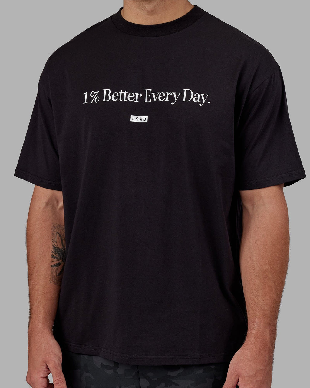 Man wearing Unisex 1% Better FLXCotton Tee Oversize - Black