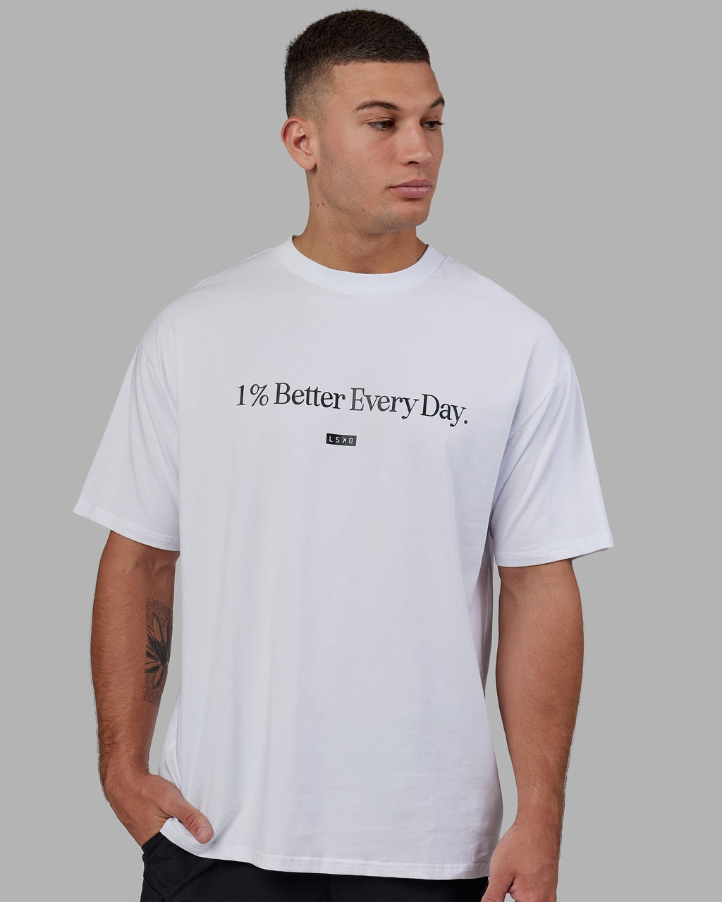 Man wearing Unisex 1% Better FLXCotton Tee Oversize - White