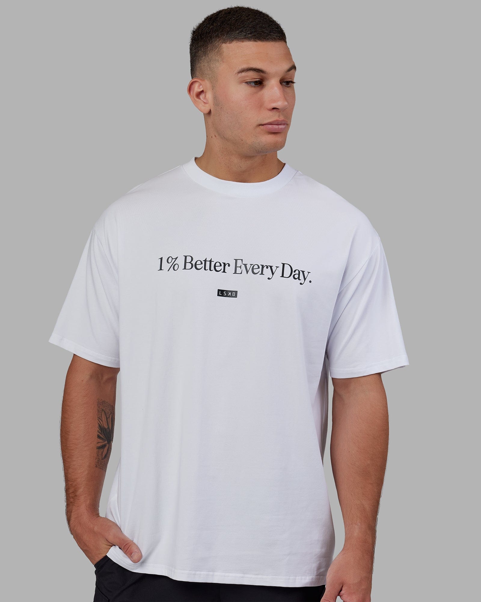 Man wearing Unisex 1% Better FLXCotton Tee Oversize - White